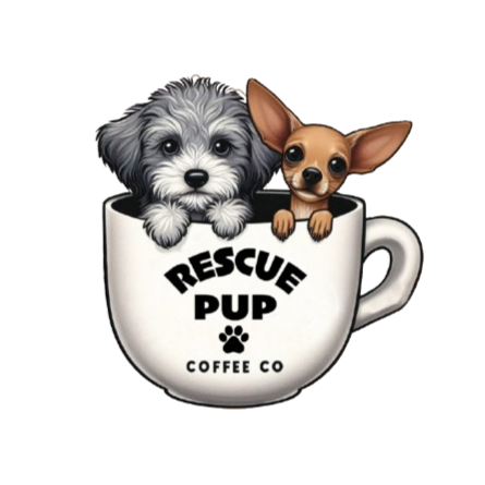 Two puppies peeking out of a coffee mug with "Rescue Pup Coffee Co" written on it.