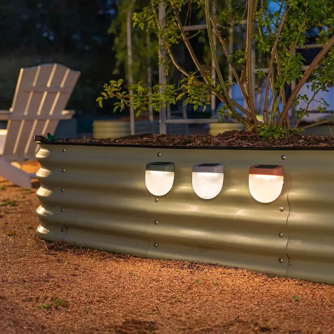 Rippled_Solar_Garden_Light_on_garden_bed_with_chairs.webp