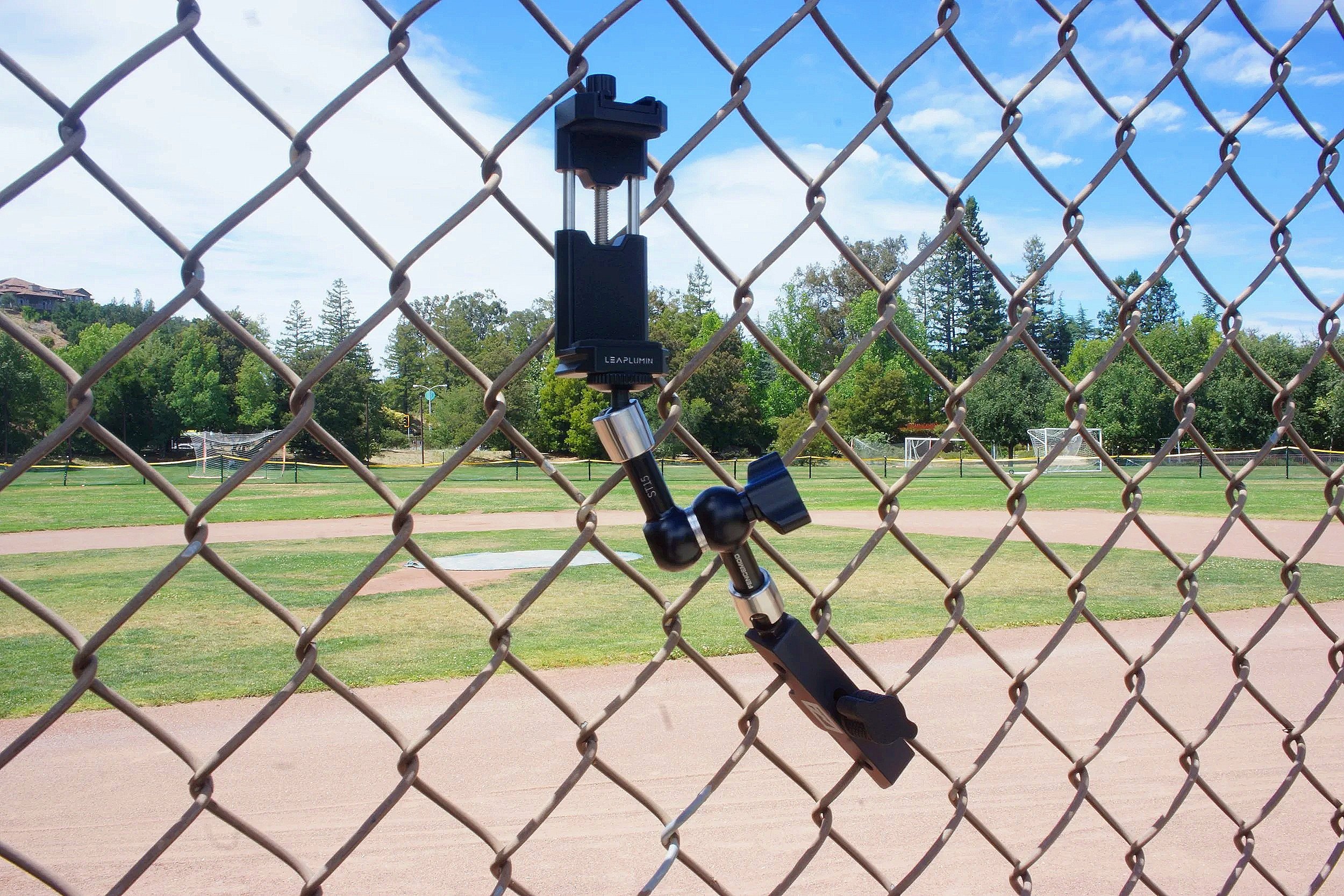 his image depicts the phone attachment mounted using the Fence Mod Chain Link Fence Camera Mount for GameChanger streaming with the extension arm attachment.