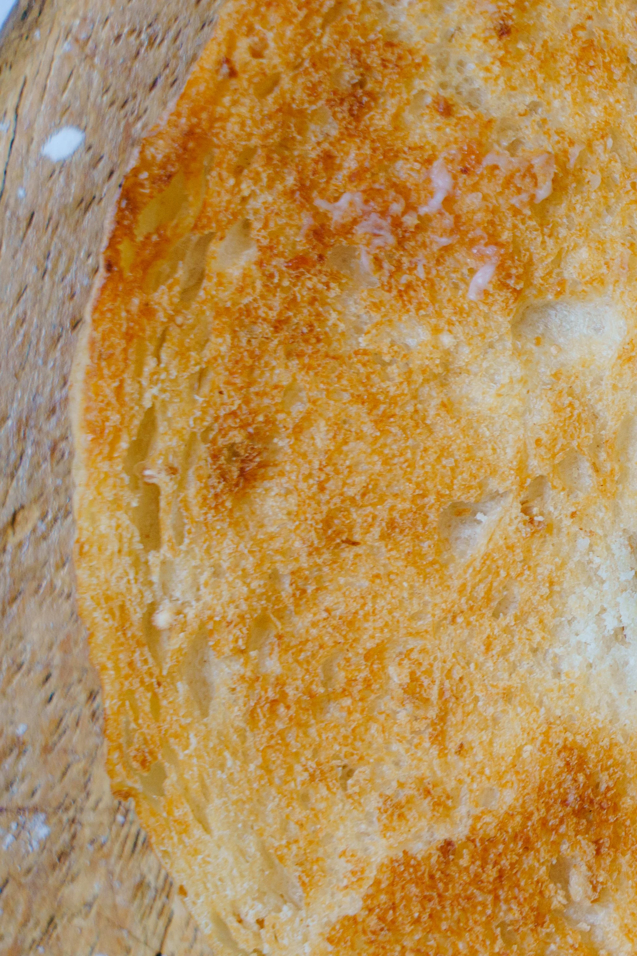Close-up of a fried egg with crispy edges.