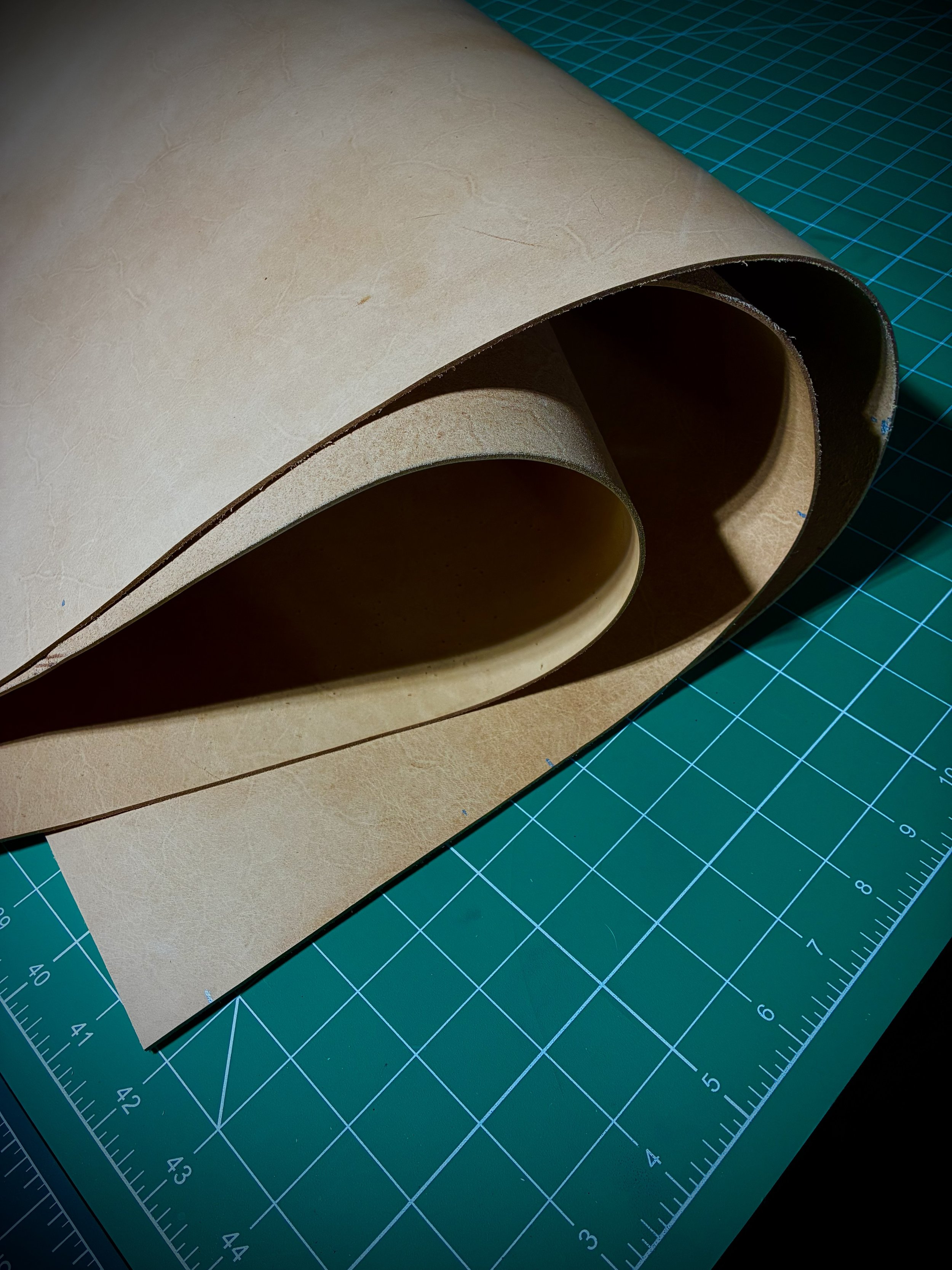 Rolls of high quality vegetable tanned, full grain leather, used for making leather goods.