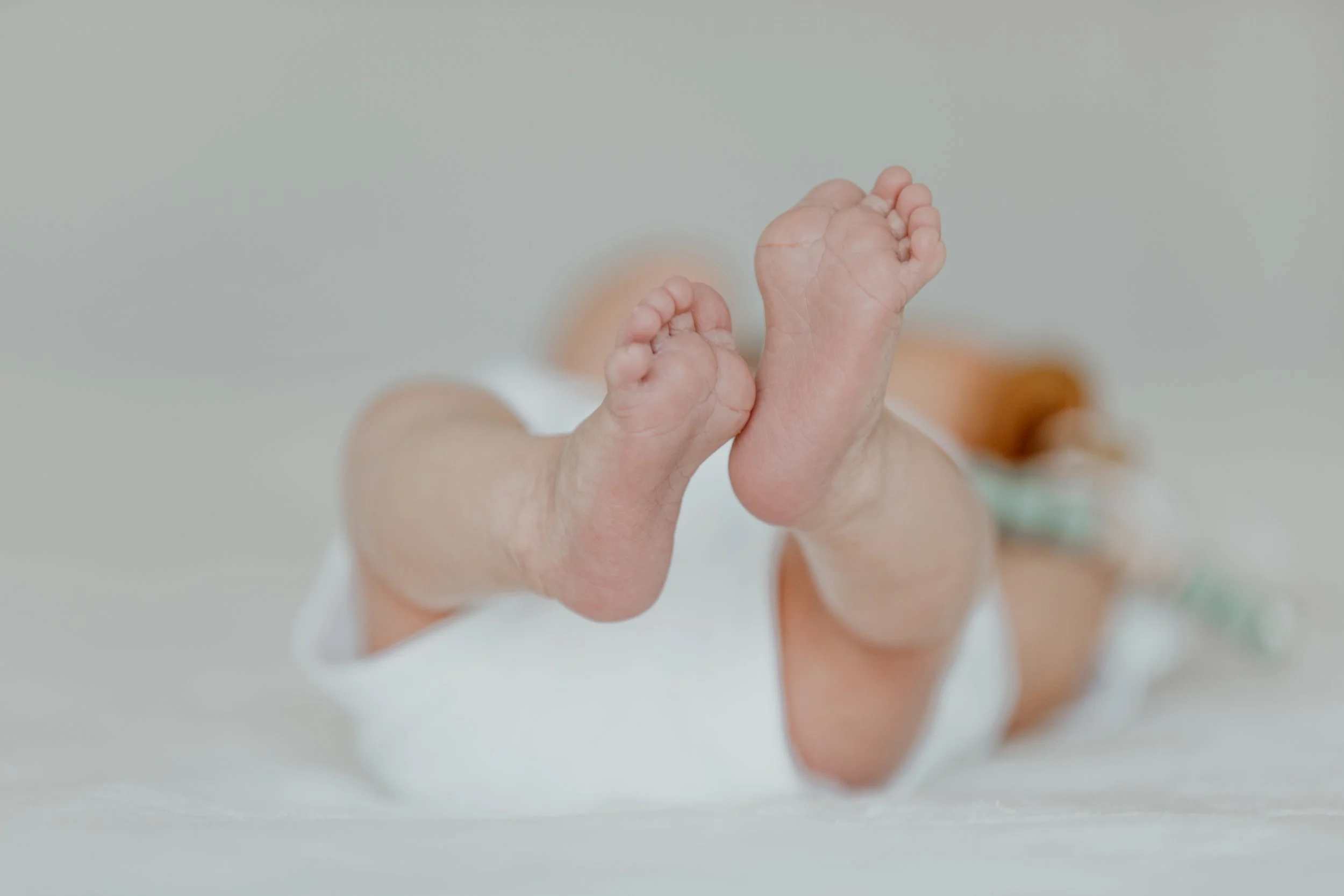 Lifestyle baby portraits photographed with natural light in The Woodlands, Texas.