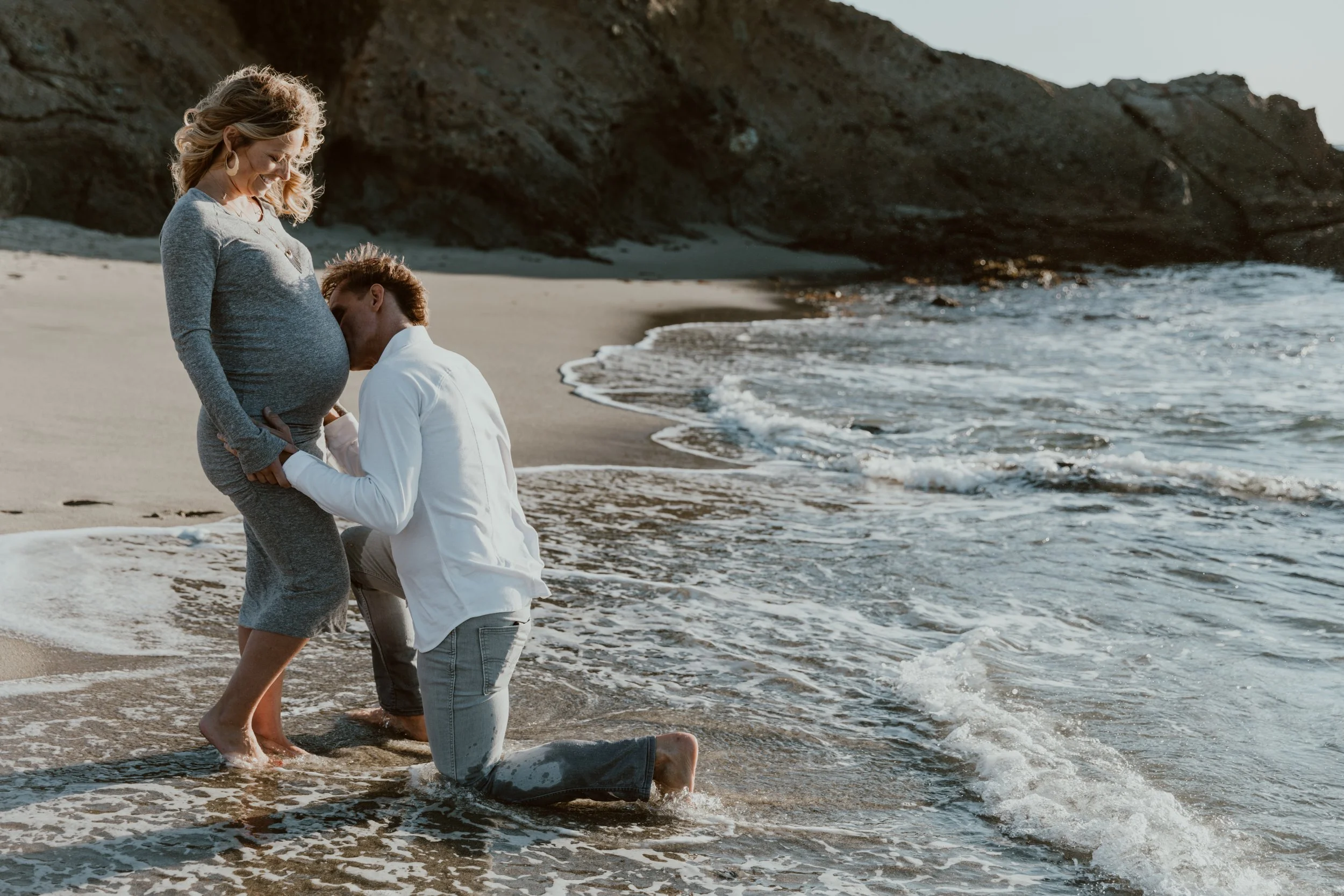 Outdoor maternity photography capturing candid moments and genuine connection.