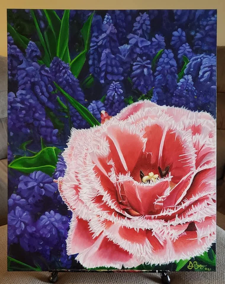 A painting of pink fringed-edged flower with bees, surrounded by purple flowers and green foliage.