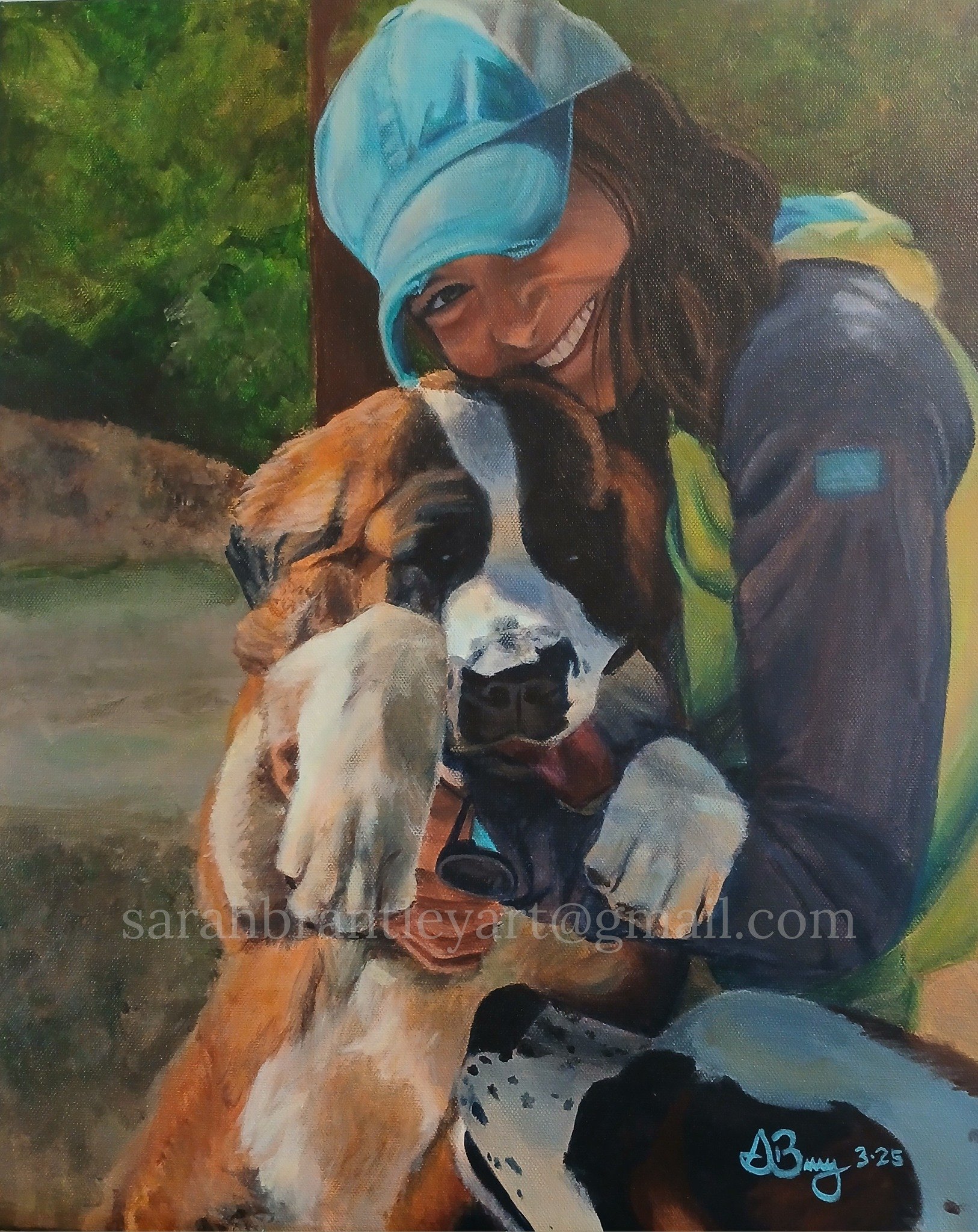 A woman wearing a blue cap and outdoor clothing is smiling and hugging a large dog, which appears to be a St. Bernard. The woman is holding the dog close and both seem happy, with the woman showing her teeth in a big smile. The background shows green trees and a natural outdoor setting.