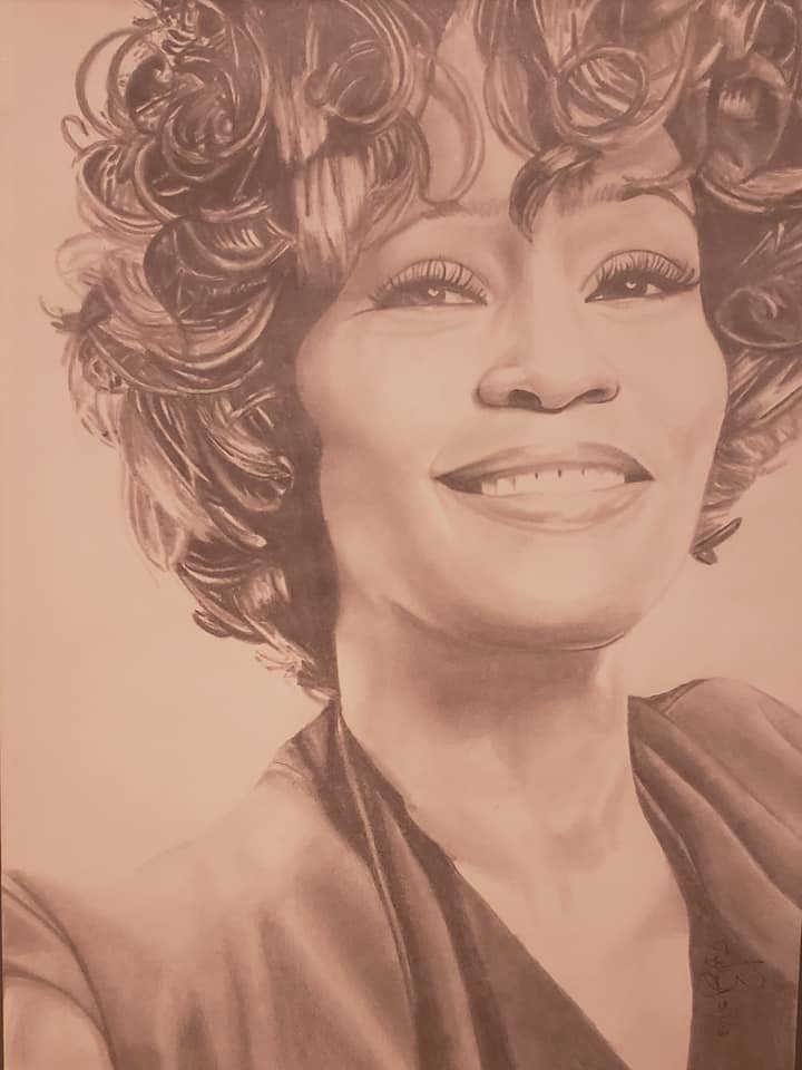 A detailed pencil drawing of a smiling woman with curly hair.