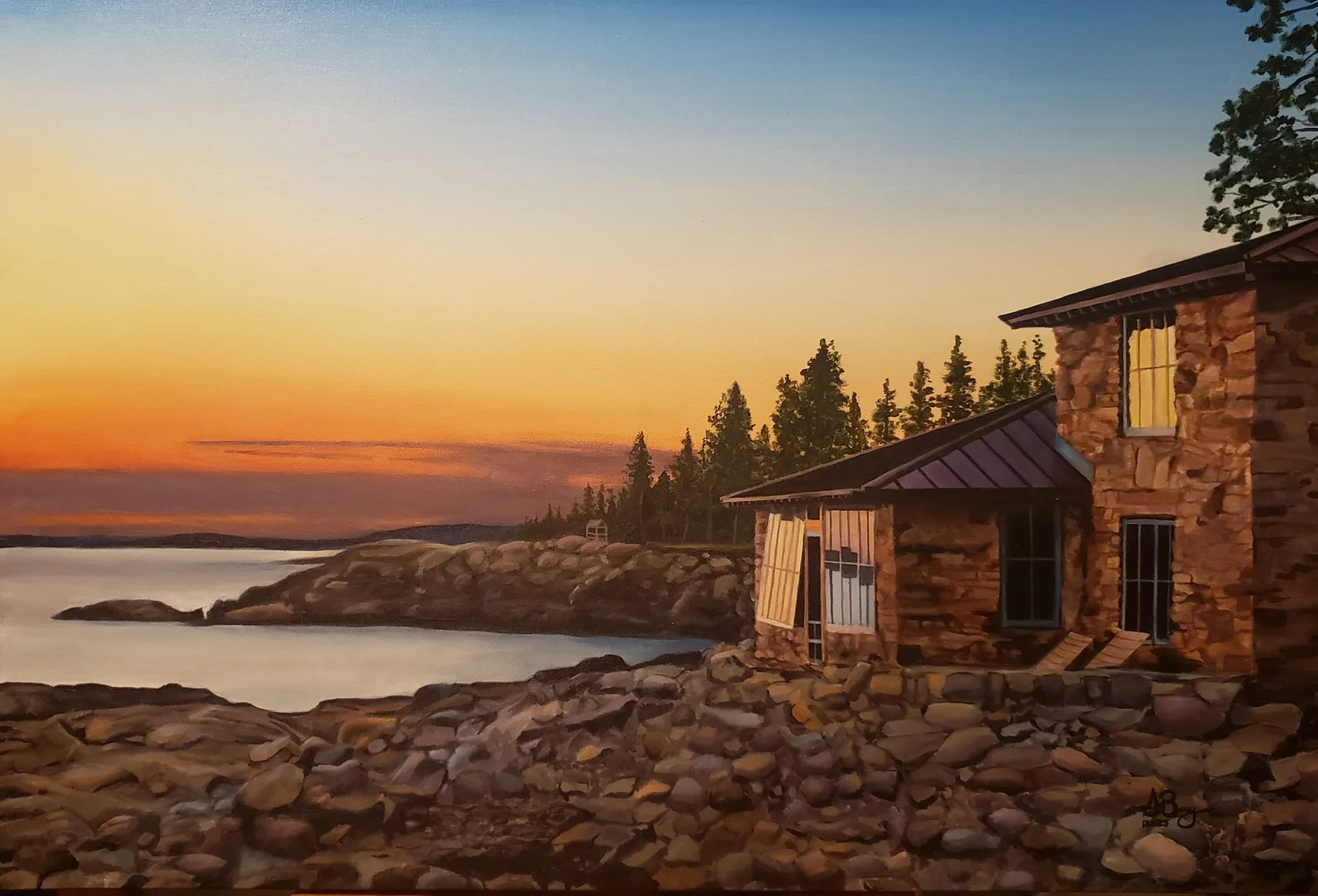 A stone house with a metal roof on a rocky shoreline at sunset, with trees in the background.