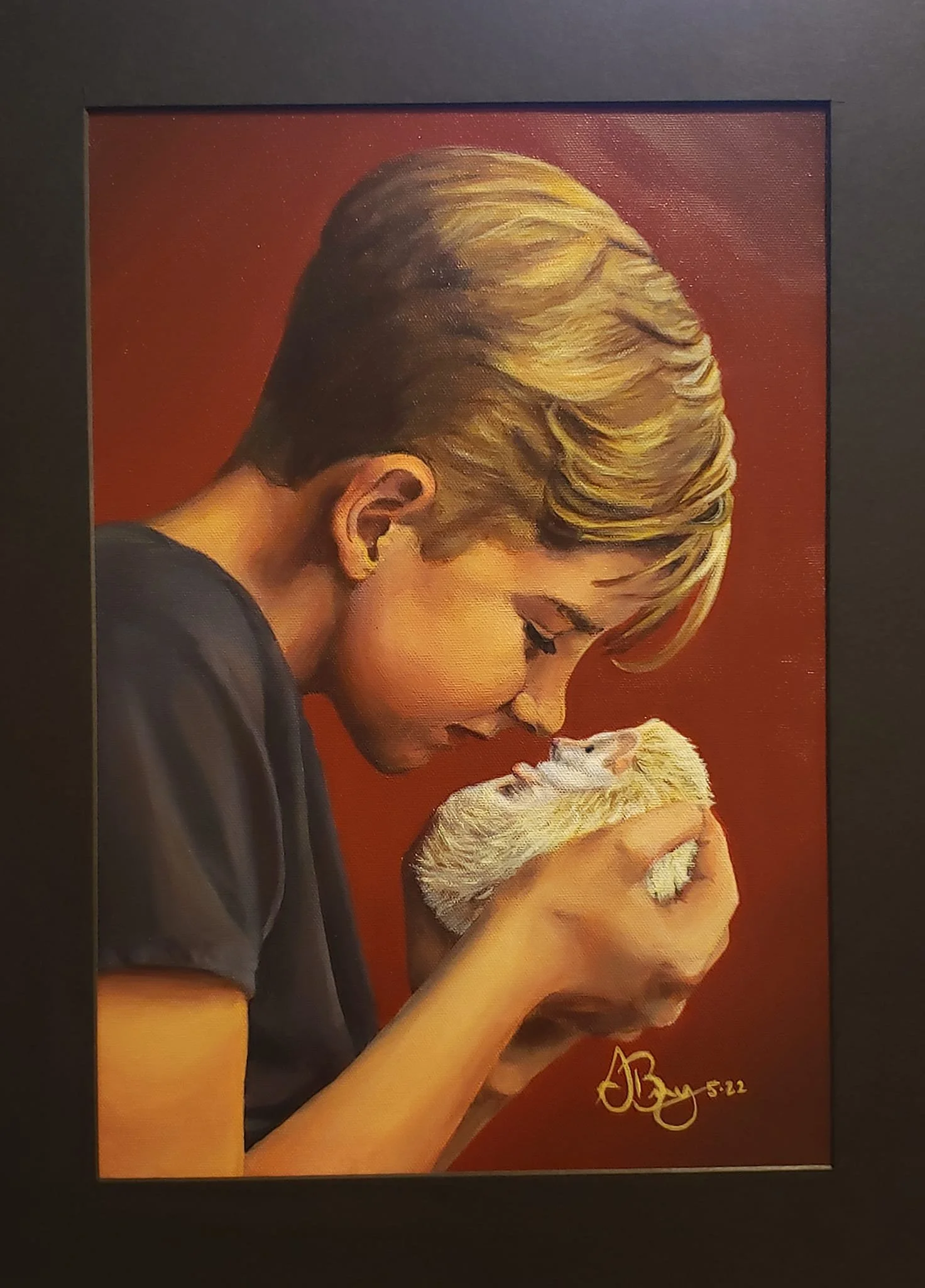 A painting of a young person with blonde hair holding a white puppy close to their face, both with eyes closed, against a red background.