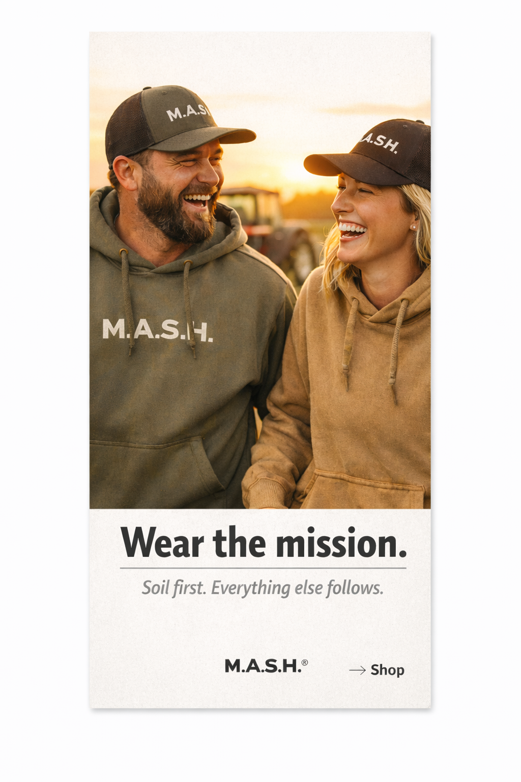 A smiling man and woman wearing M.A.S.H. branded hoodies and caps, standing outdoors at sunset with farm equipment in the background.