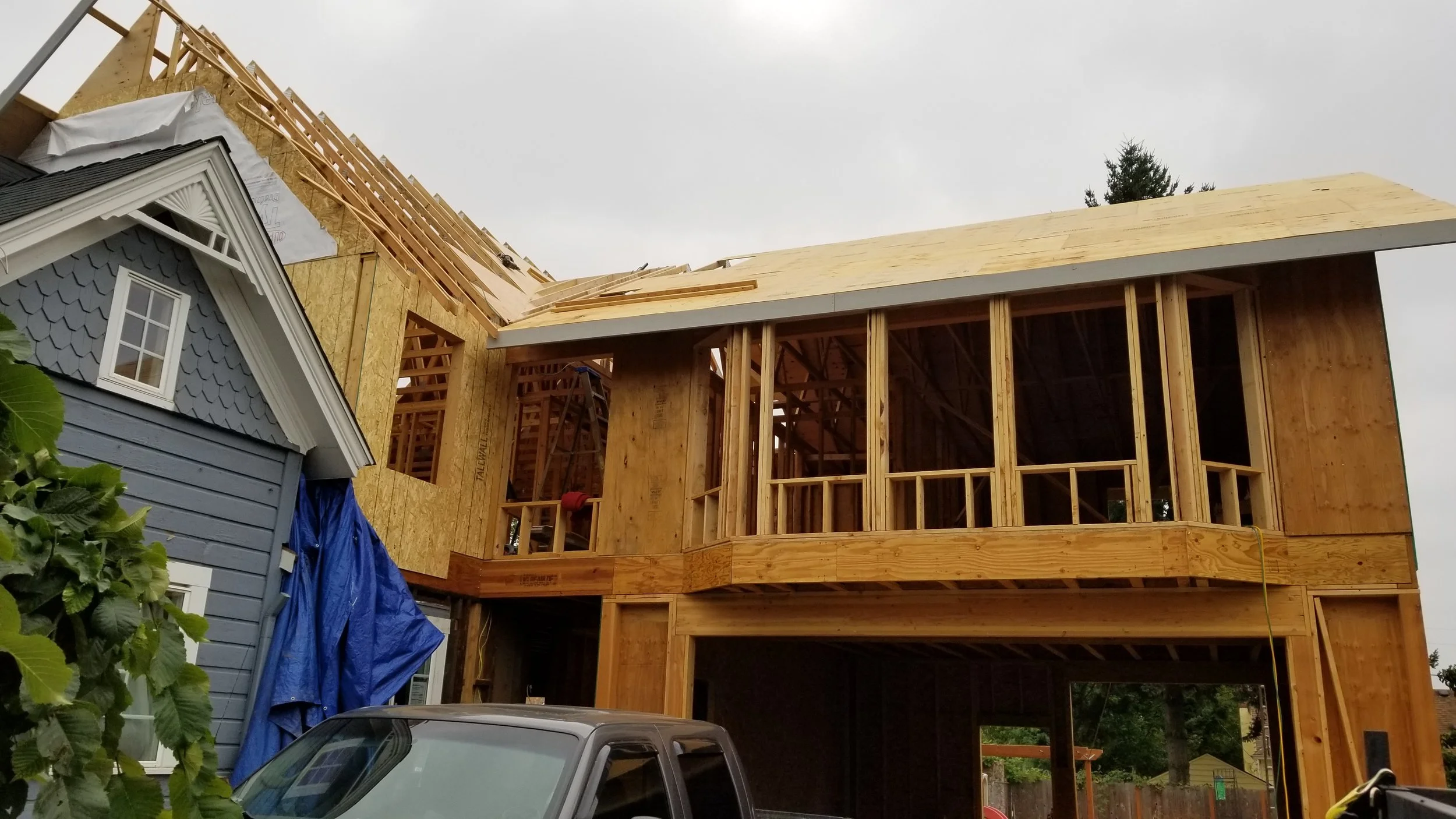 Oranssi technician working on a roof project