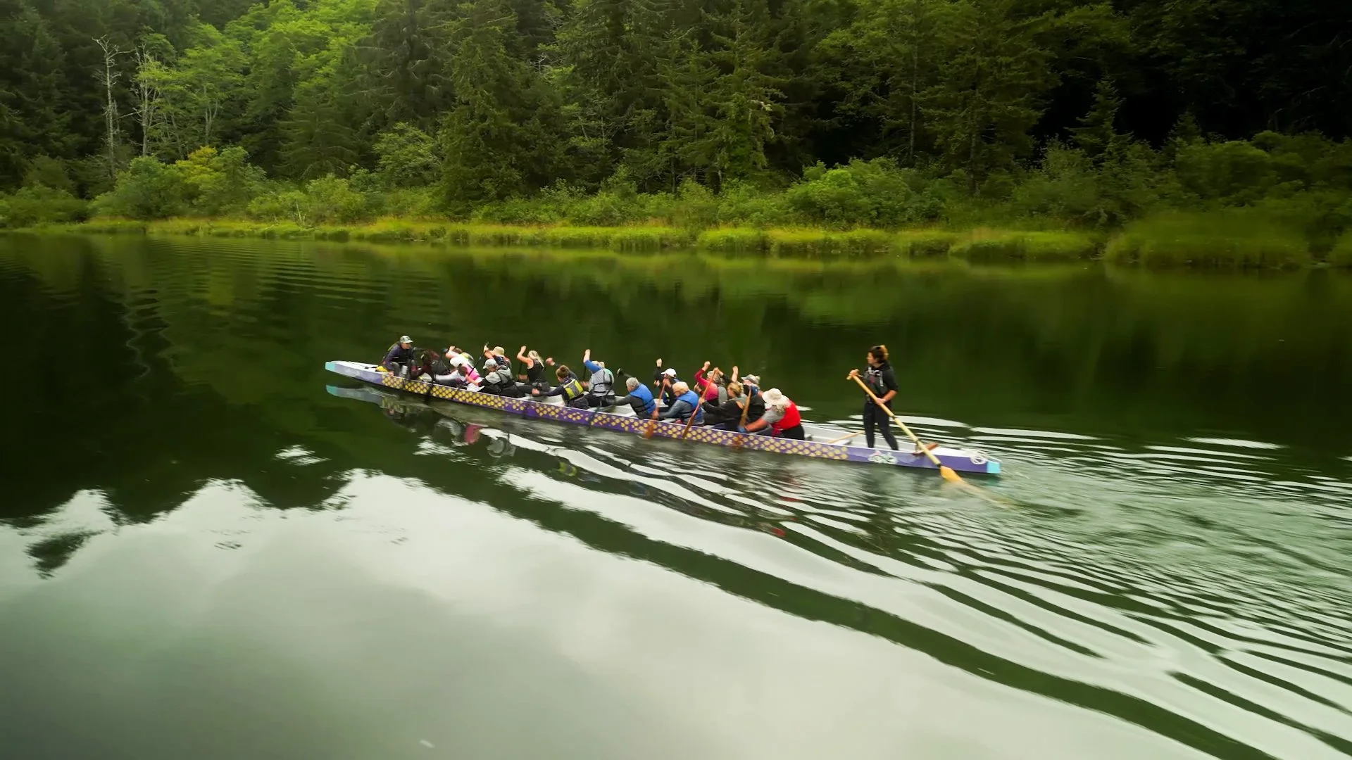 Image of North Coast Paddling Club dragon boat team practicing on the John Day River, east of Astoria, Oregon.