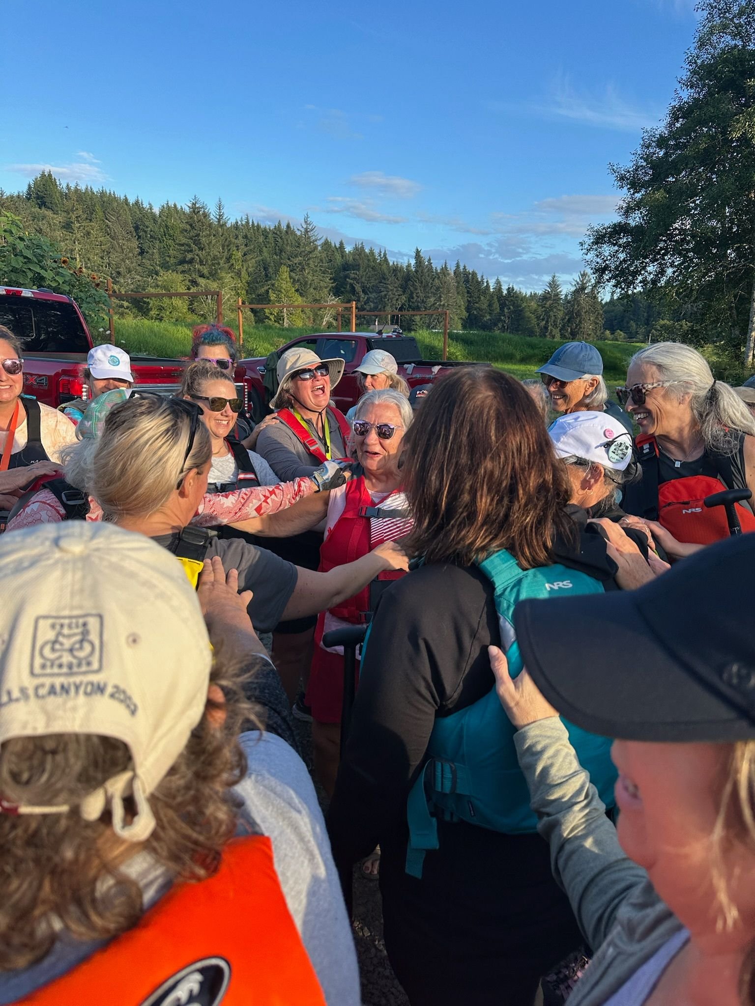 Image of North Coast Paddling Club team celebrating together.