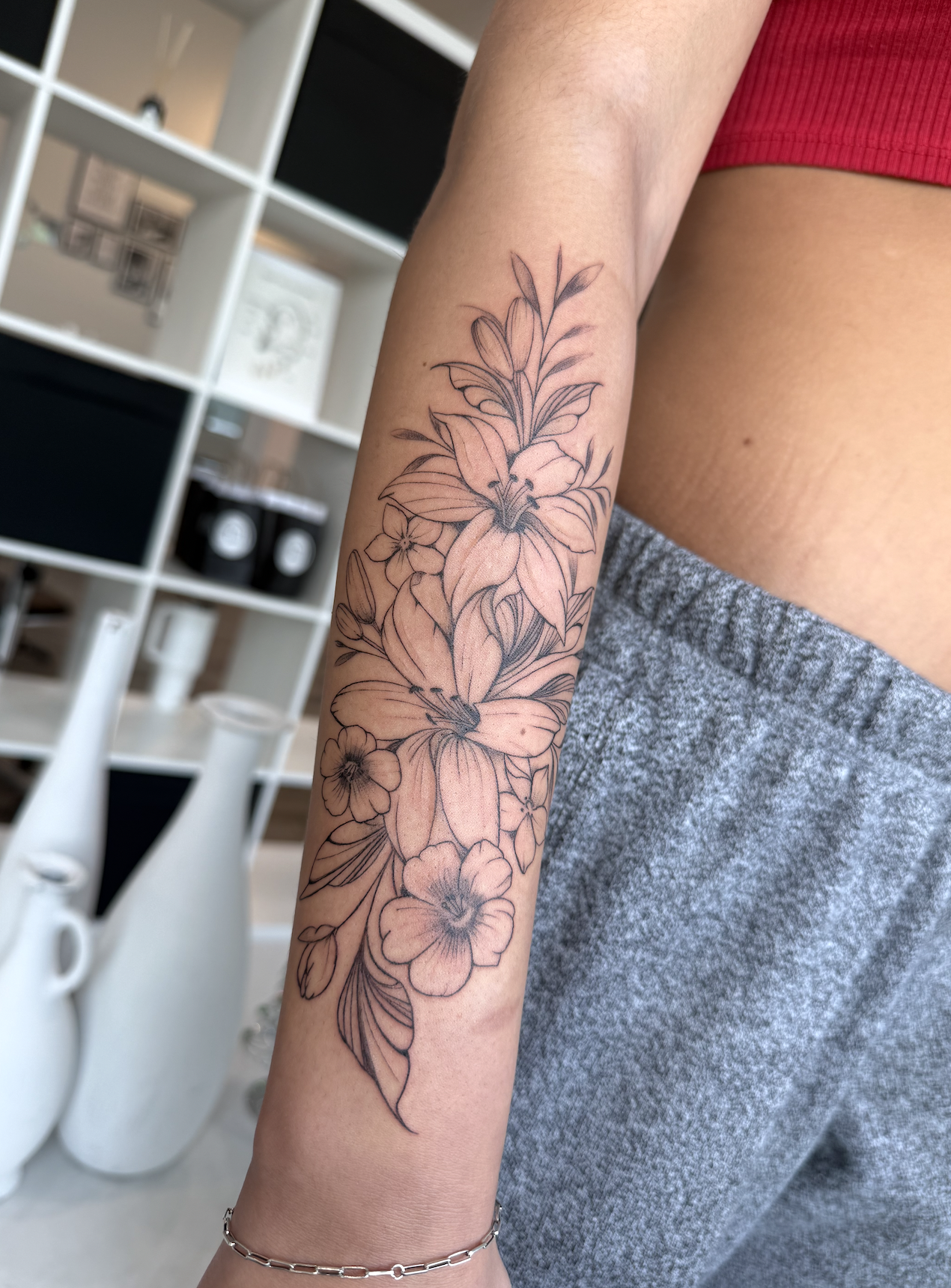 Tattoo of a flowers on an arm - fine line work