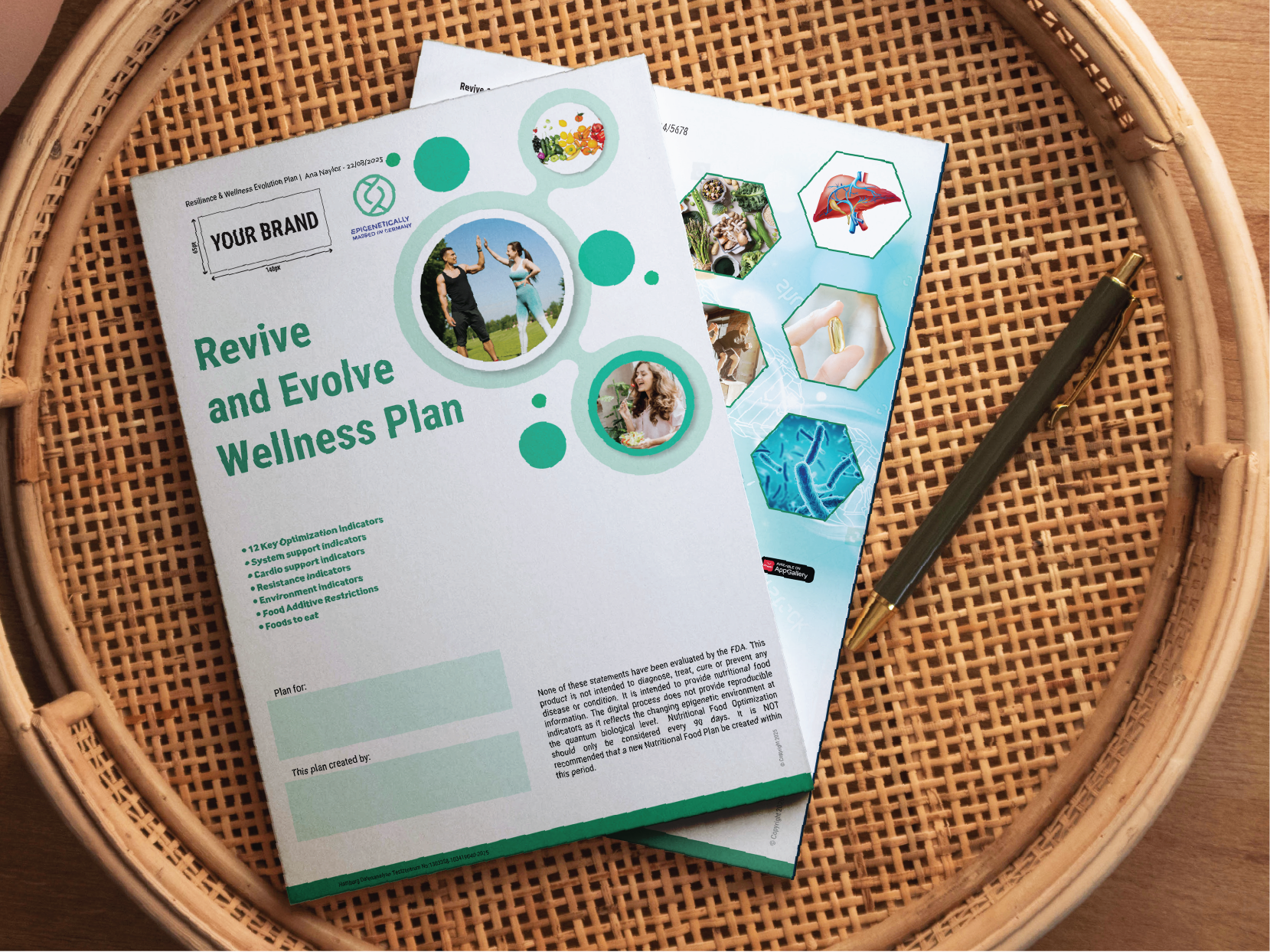 A wellness plan brochure titled 'Revive and Evolve Wellness Plan' resting on a woven rattan table, with a black pen beside it. The brochure features images of people exercising and healthy foods, along with icons and text related to health indicators.