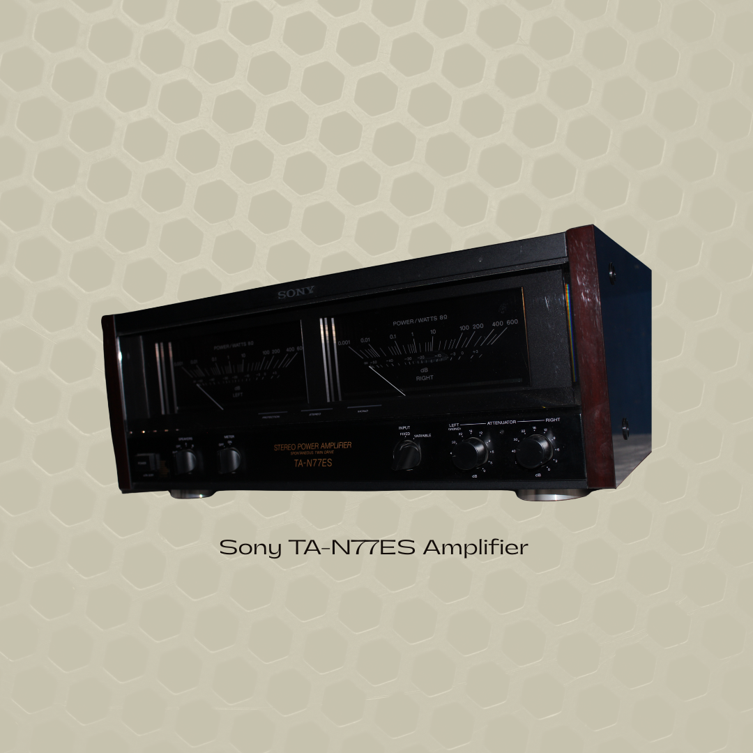 A vintage Sony TA-N77ES stereo power amplifier with a black front panel, wooden side panels, and various knobs and meters on the front, set against a patterned honeycomb background.