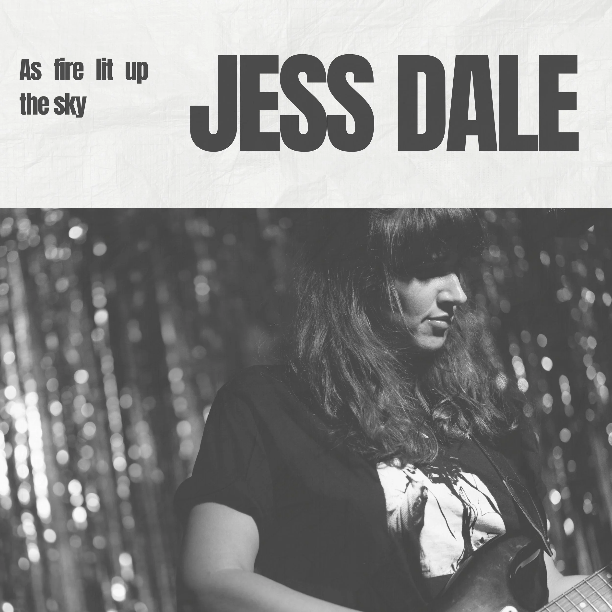 Black-and-white album cover featuring a woman with curly hair playing guitar in a forest, with the text 'As fire lit up the sky' and 'JESS DALE' in bold letters.