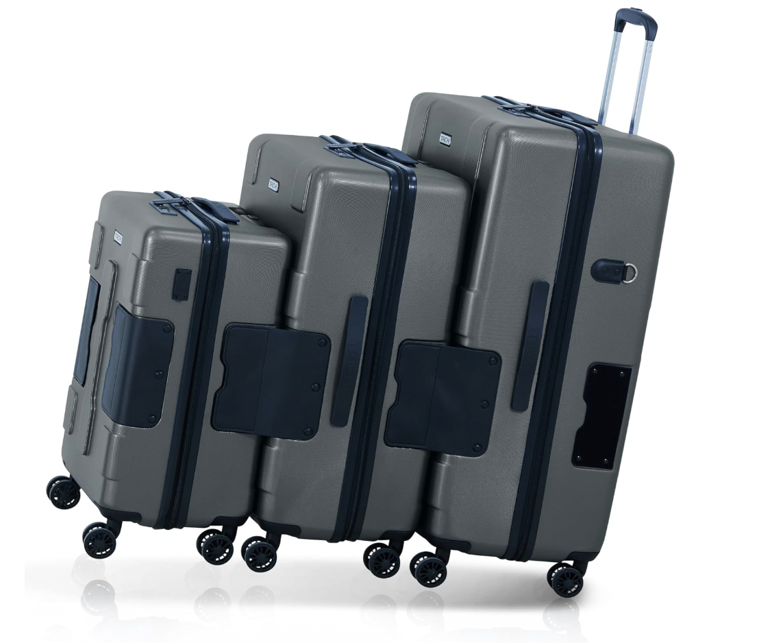 Set of three gray hard-shell rolling suitcases of different sizes with black wheels and handles, stacked together.