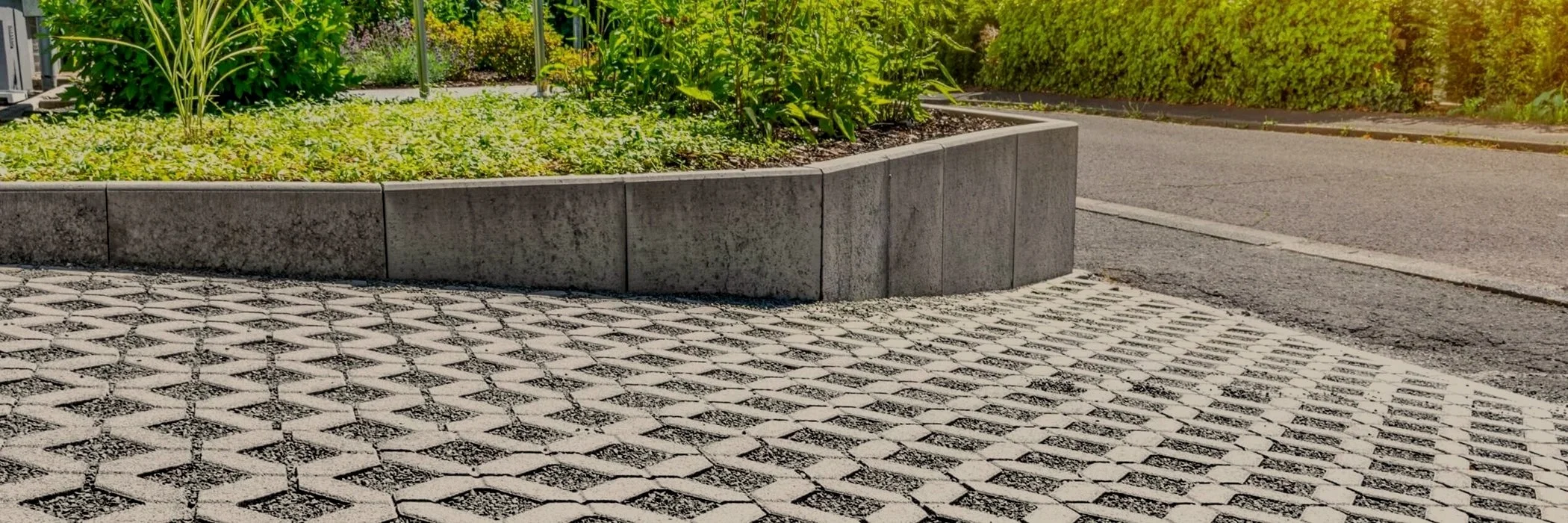 porous pavement with green grass and bushes