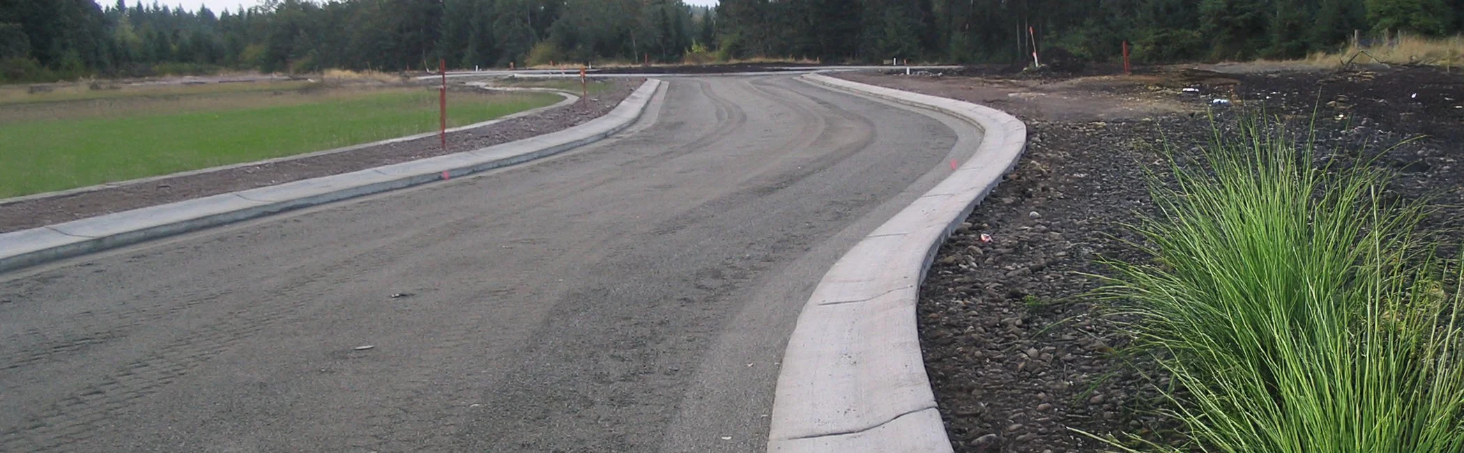 porous pavement road with green grass