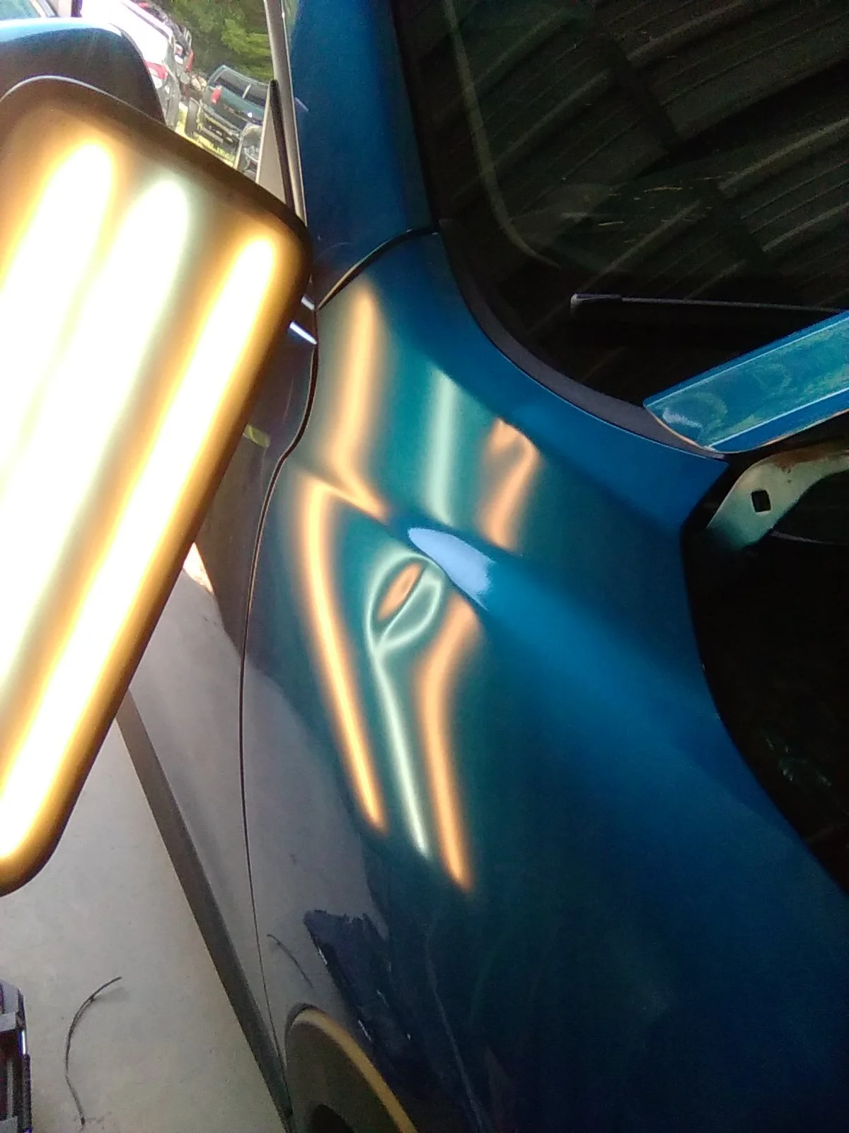 Before of PDR on Mazda CX30 right fender