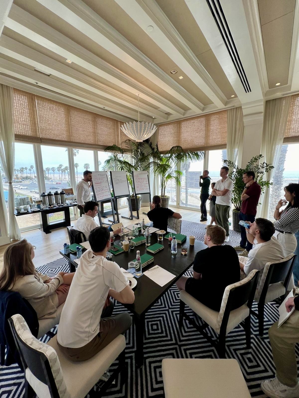 Senior leaders working around a table at a leadership conference