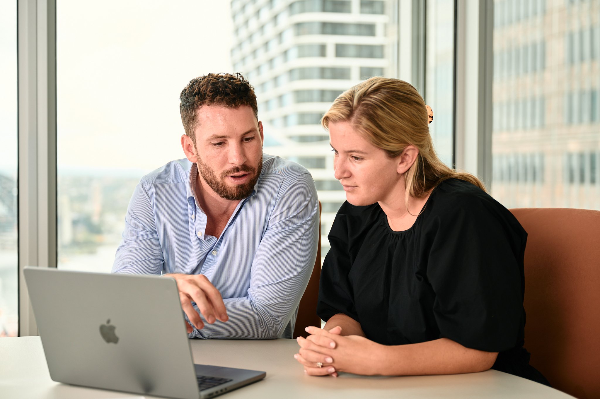 Linton Chalmers working through a plan on a laptop with a client
