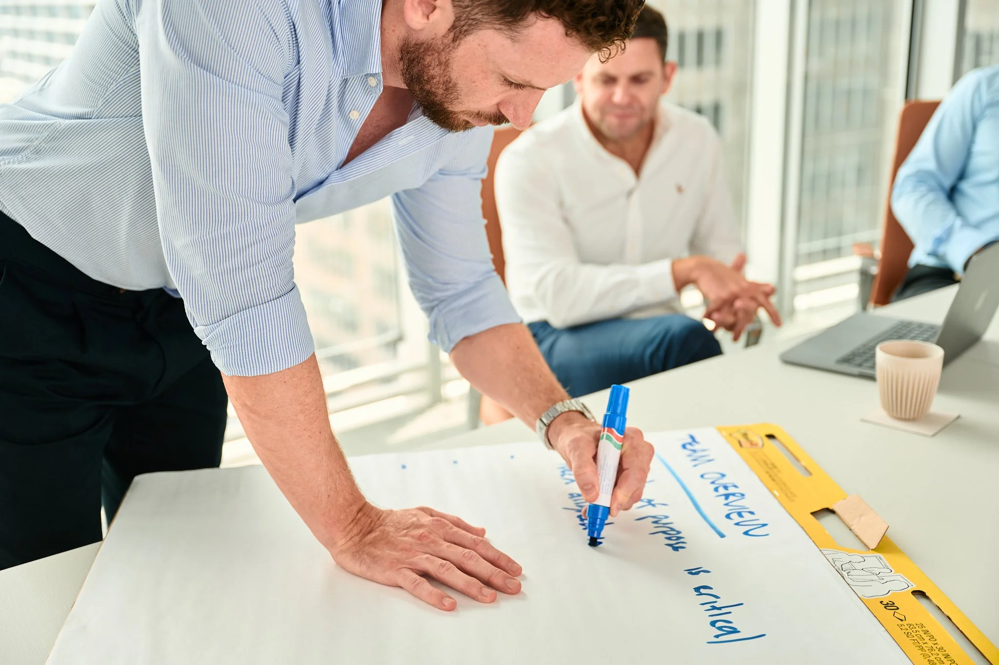 Linton Chalmers mapping priorities on paper during a leadership team session