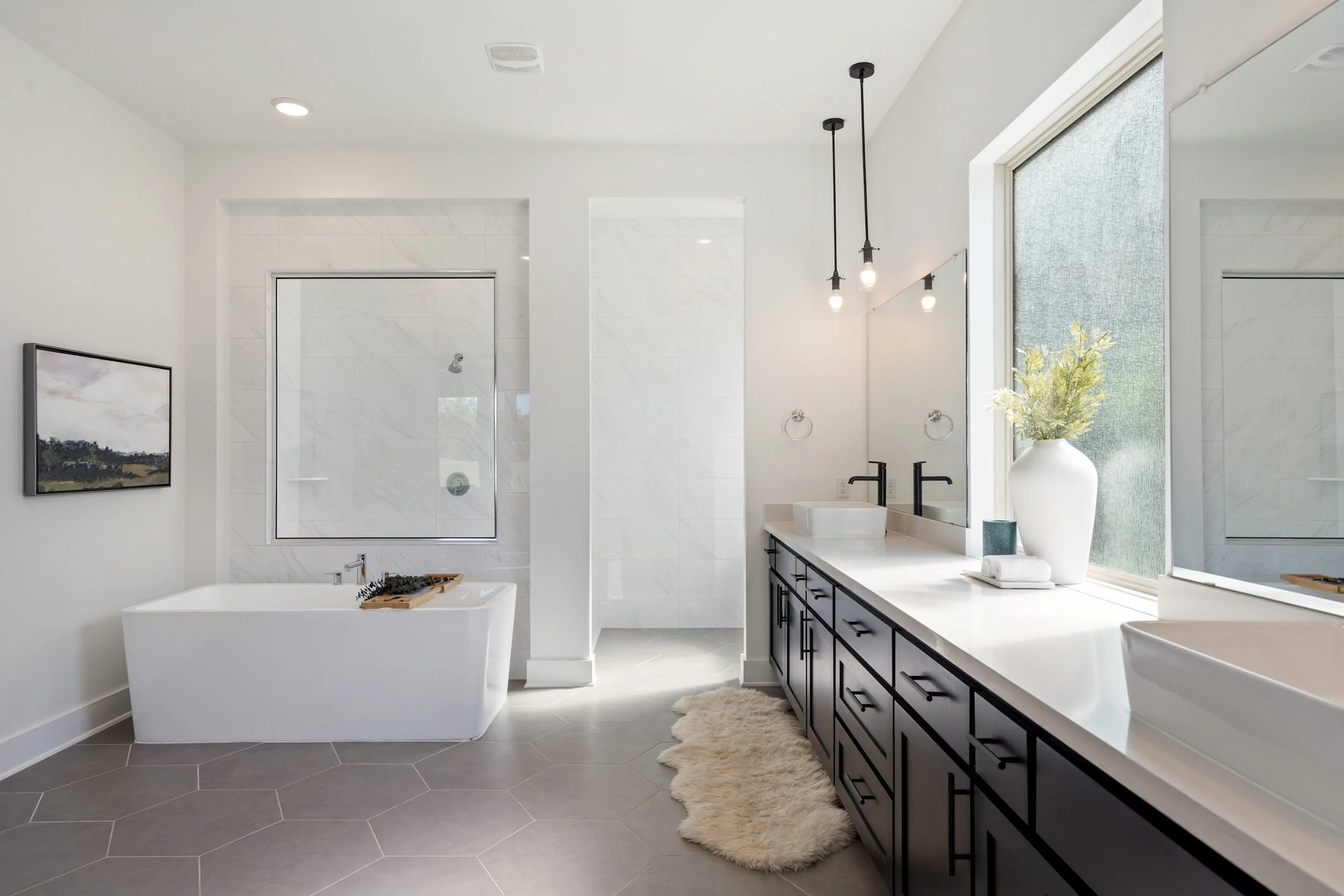 Luxury Austin bathroom with freestanding tub, walk-in shower, double vanity, quartz counters, modern fixtures