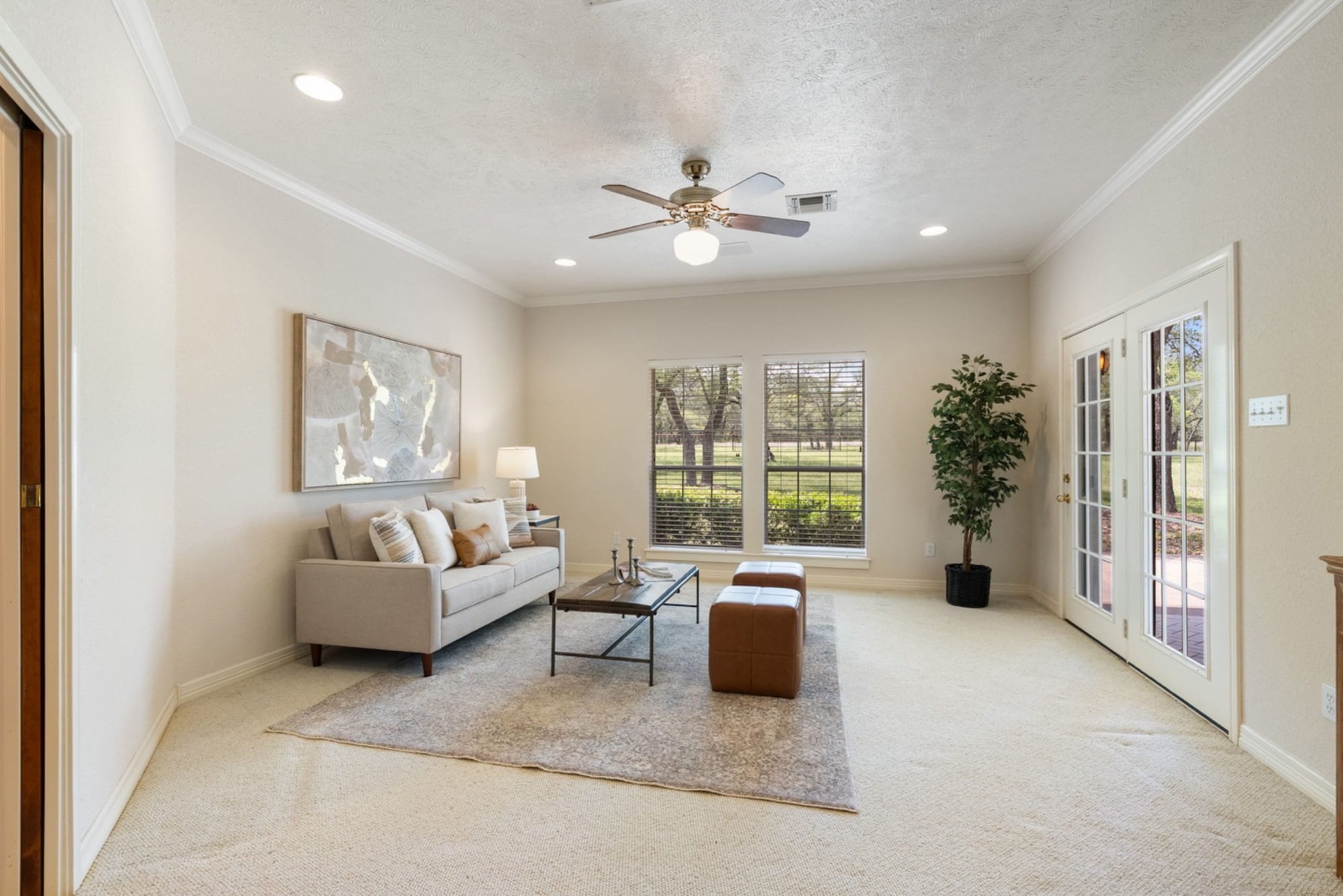 Bonus living area with backyard views and direct access to the outdoor patio.