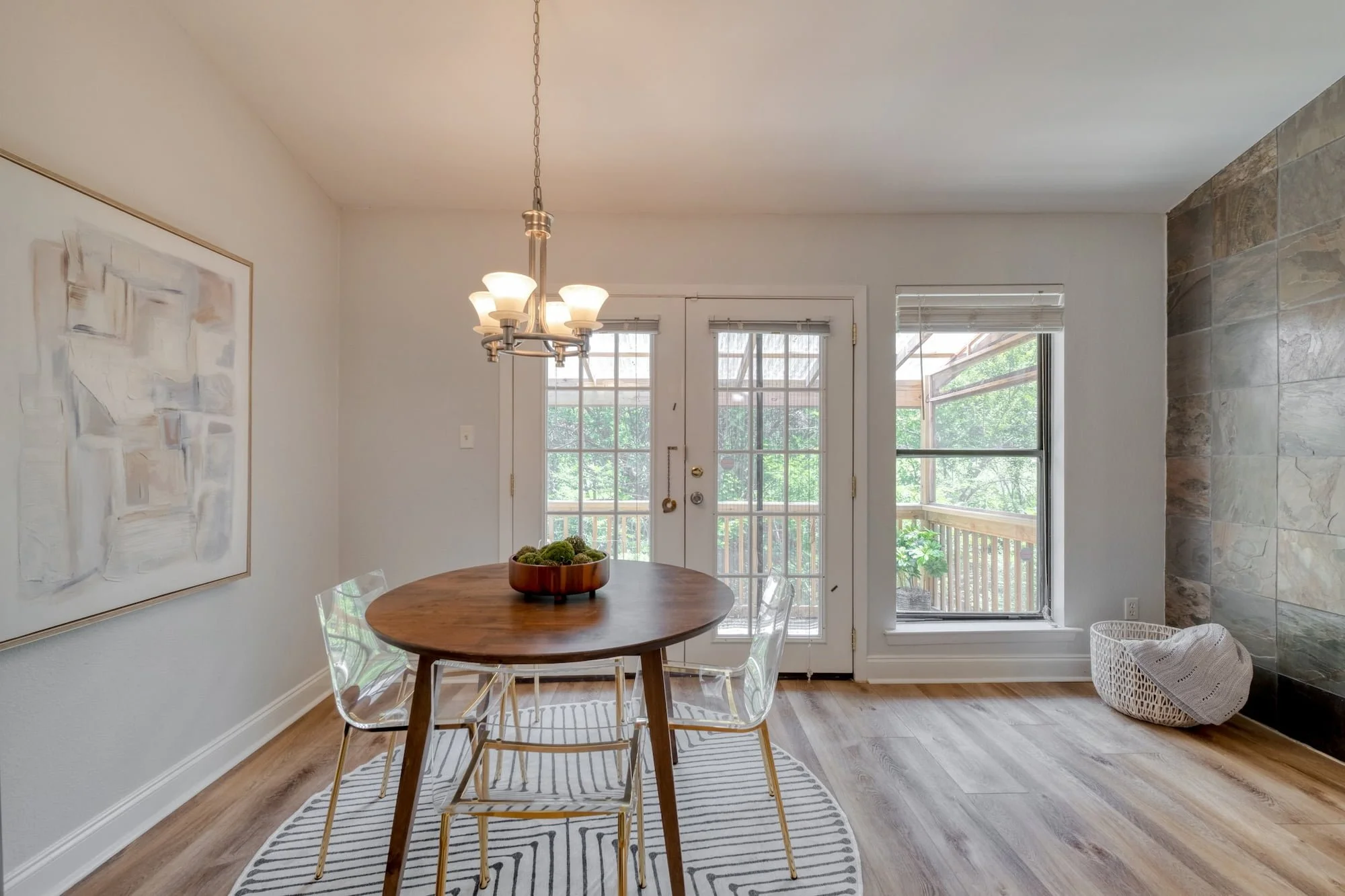 Bright dining area with covered patio access and modern furnishings