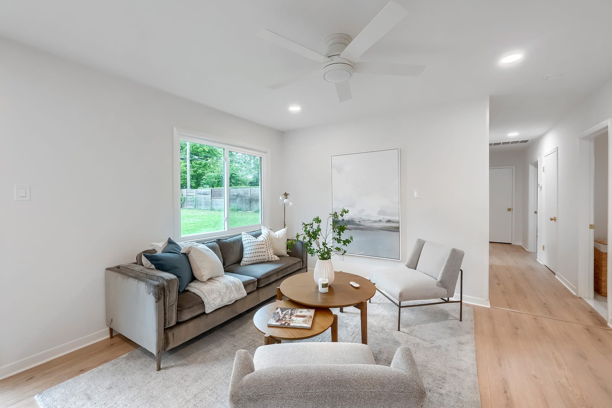 Comfortable gathering space highlighted by warm wood flooring and a clean, modern aesthetic.