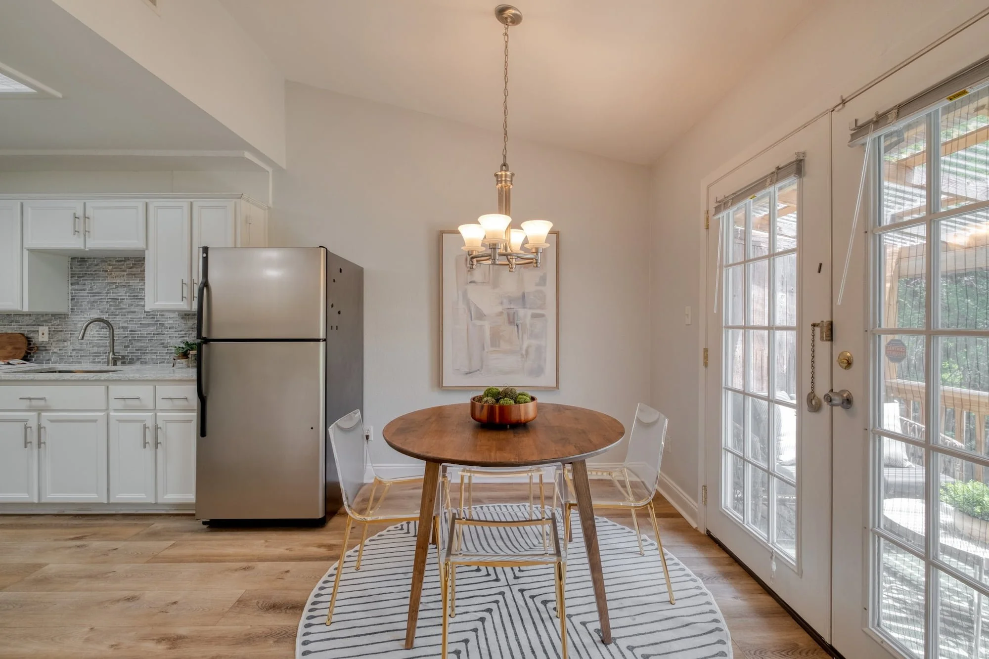 Dining area with covered patio access and natural light