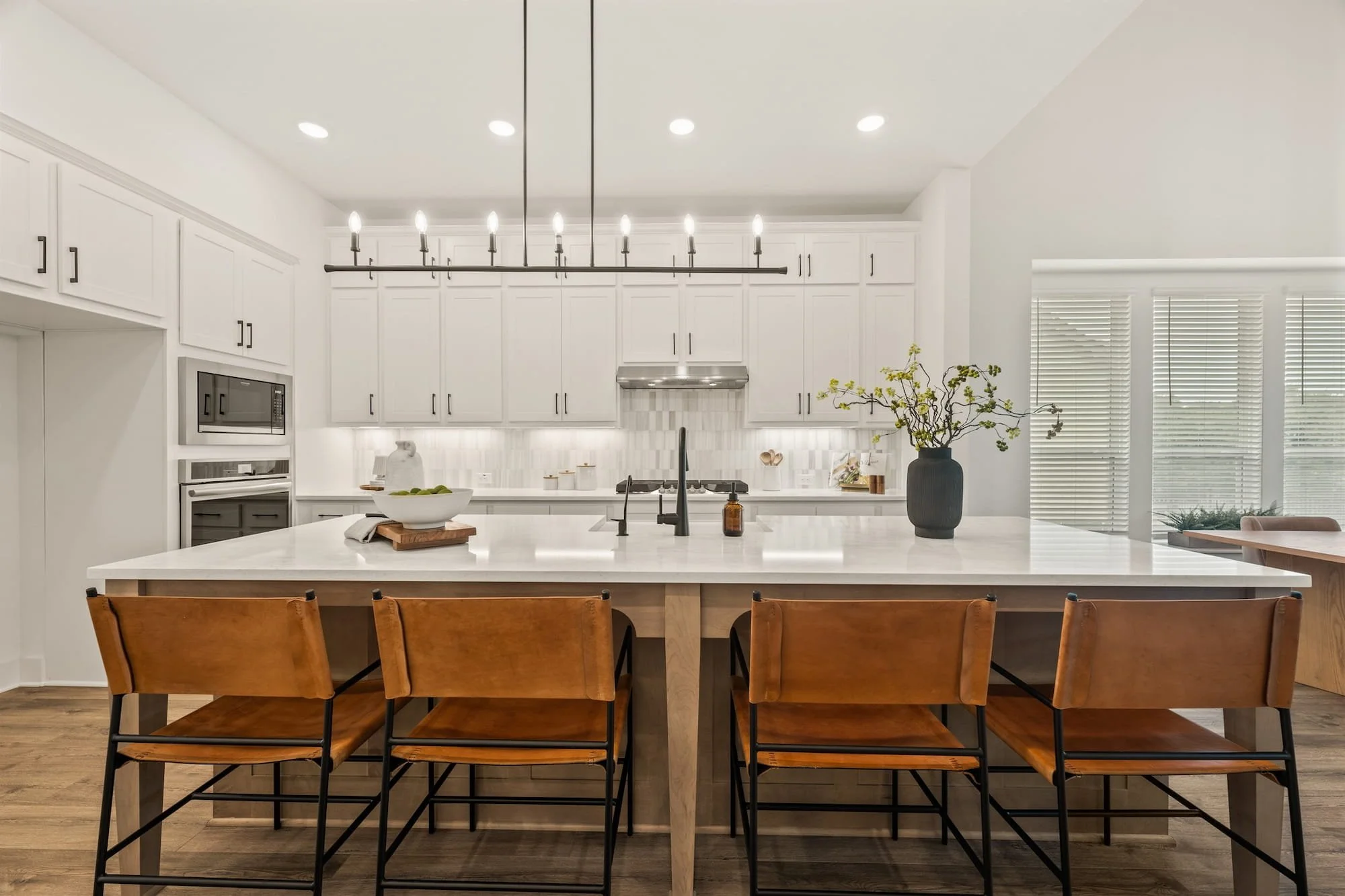 Leander luxury kitchen with oversized island, custom cabinetry, and designer lighting