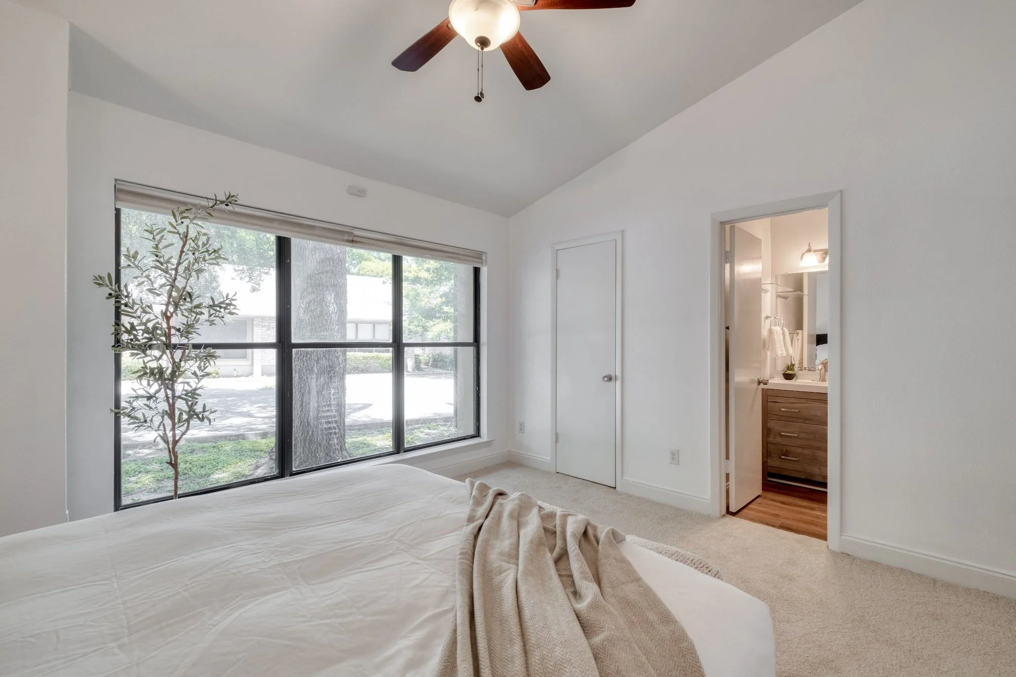 Bedroom with ensuite bath and oversized window