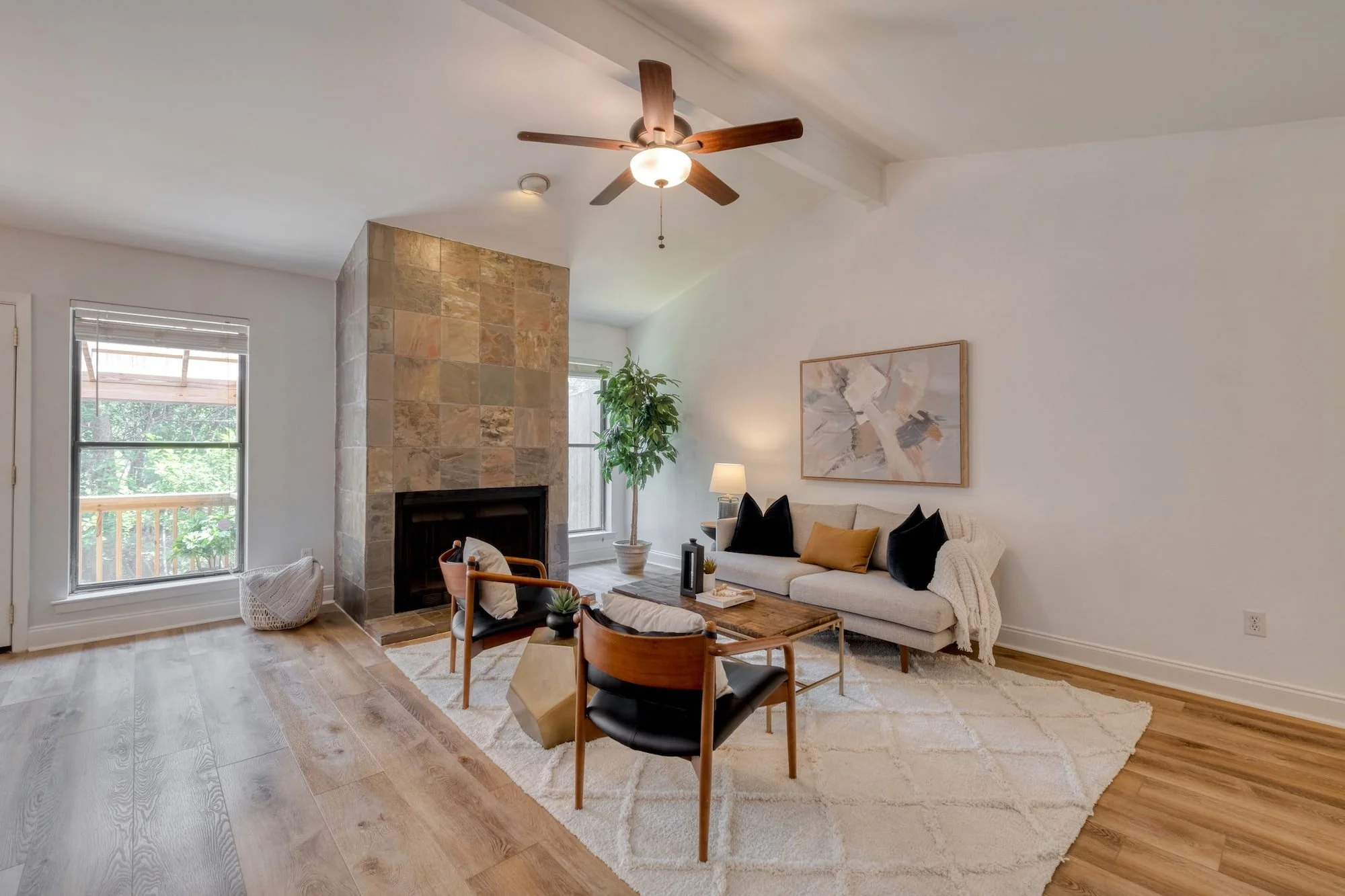 North Loop, Central Austin living room with vaulted ceilings and stone fireplace