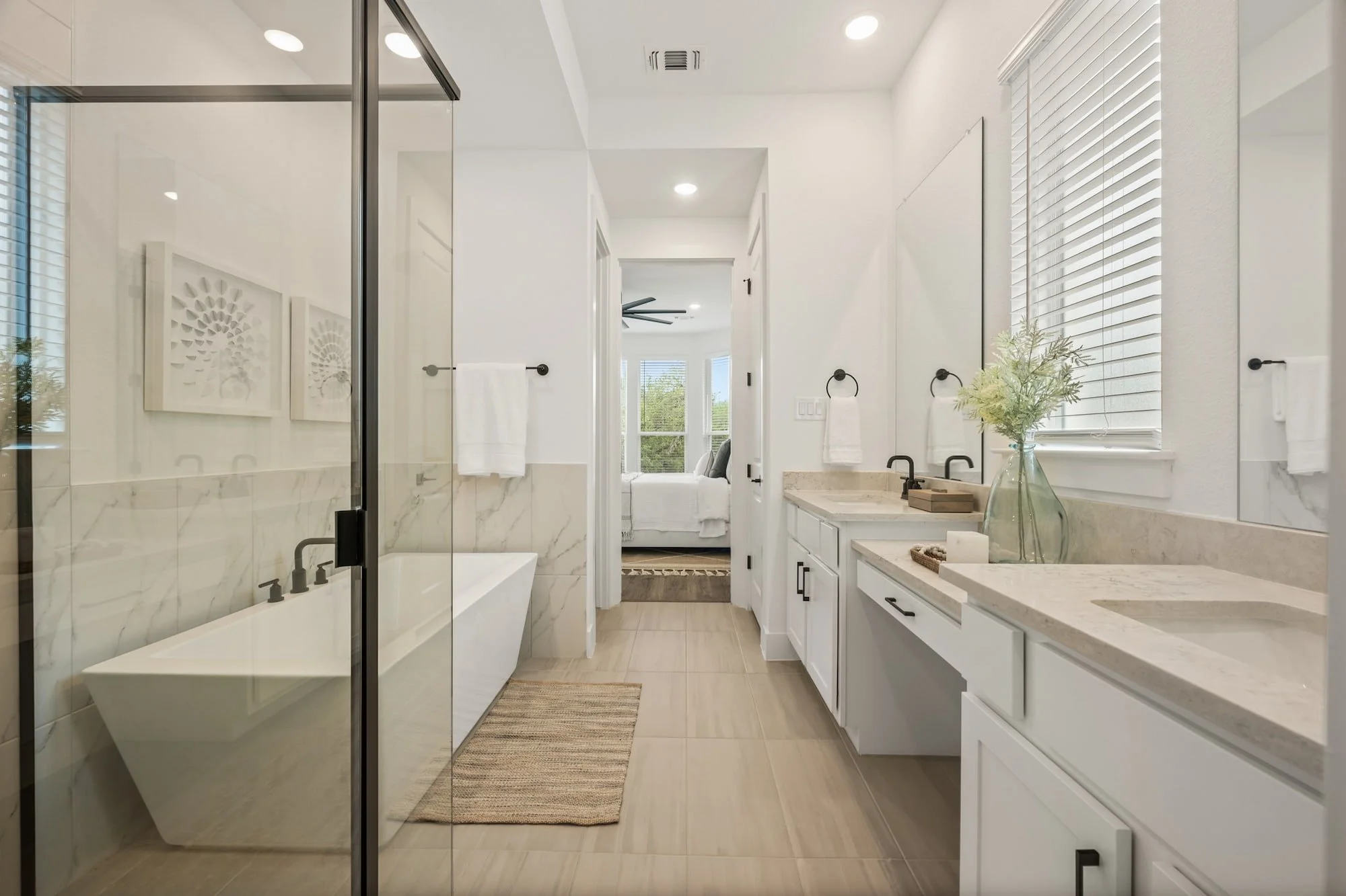 Luxurious primary bath featuring a soaking tub, oversized shower, and dual-sink vanity