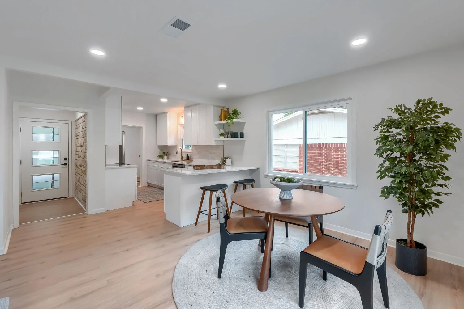 Inviting dining space with abundant natural light and easy flow into the updated kitchen.