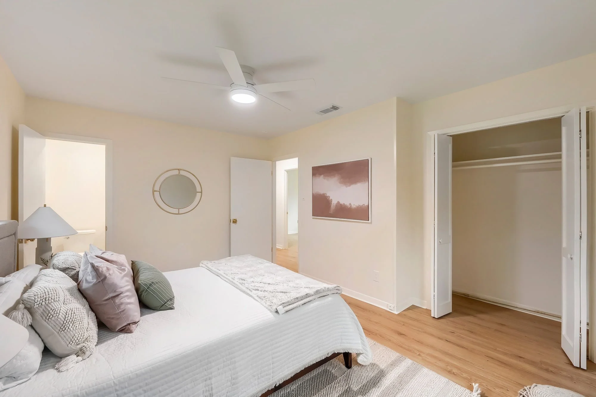 Serene bedroom retreat with thoughtful staging, abundant storage, and timeless design elements.