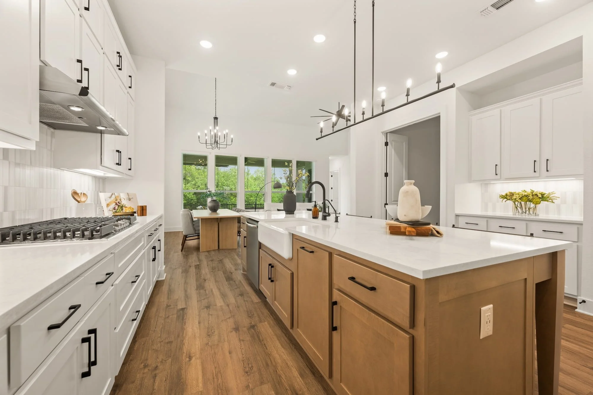 Designer kitchen with oversized island, farmhouse sink, and open-concept entertaining space