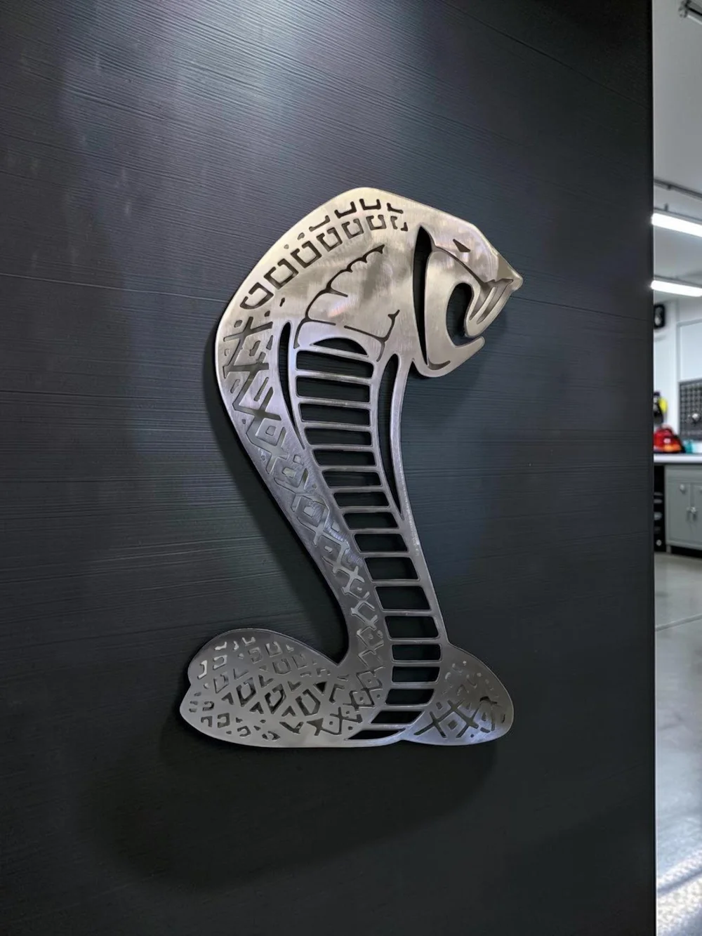 Raw steel Cobra wall art