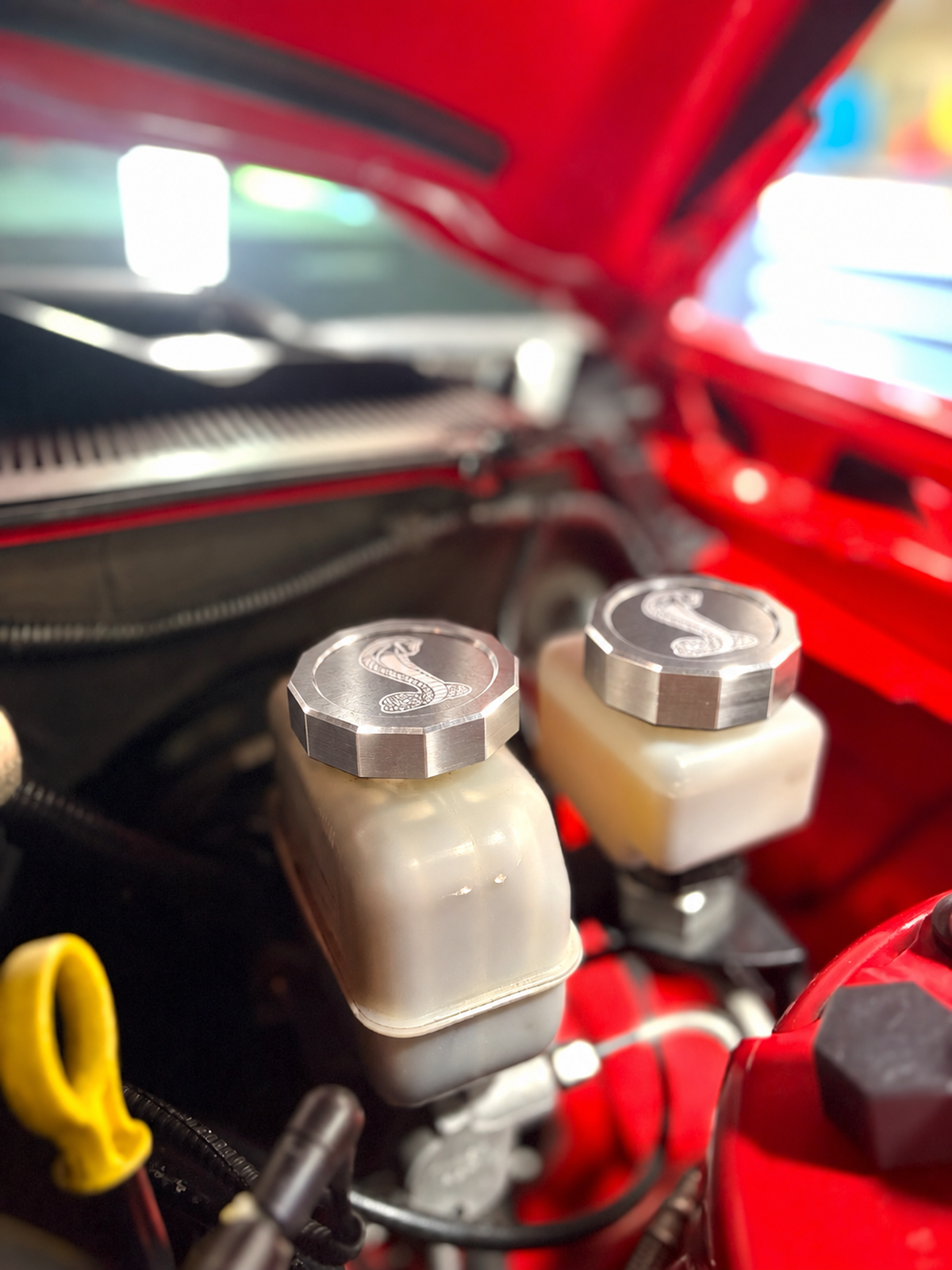 Billet brake and clutch reservoir caps in raw billet, installed, colour preview