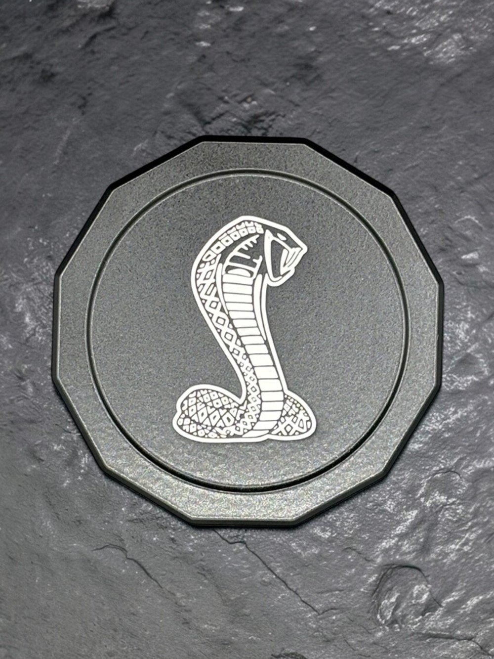 Cobra engraved reservoir cap
