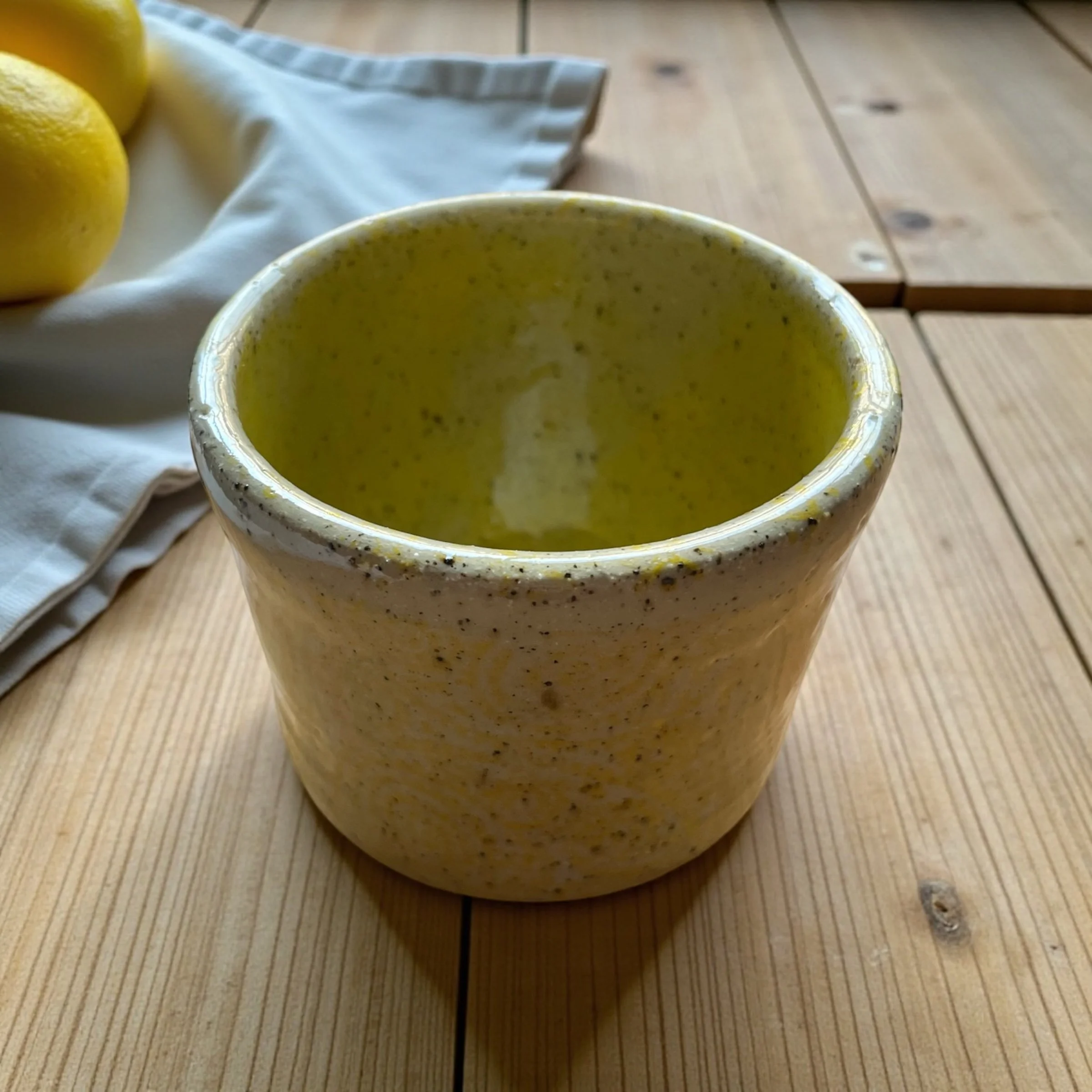 handleless lemon-yellow mug