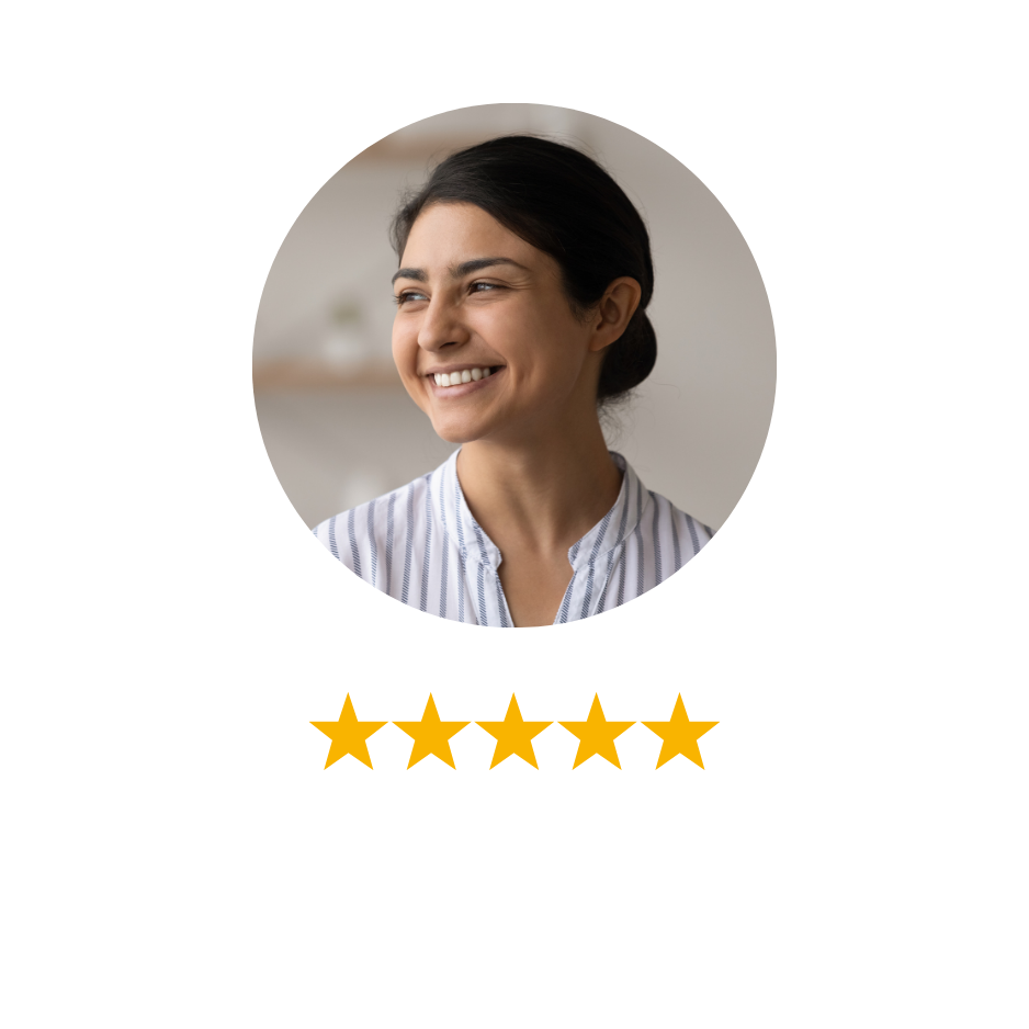 A woman with dark hair smiling and looking to the side, wearing a striped shirt, in a well-lit indoor setting.