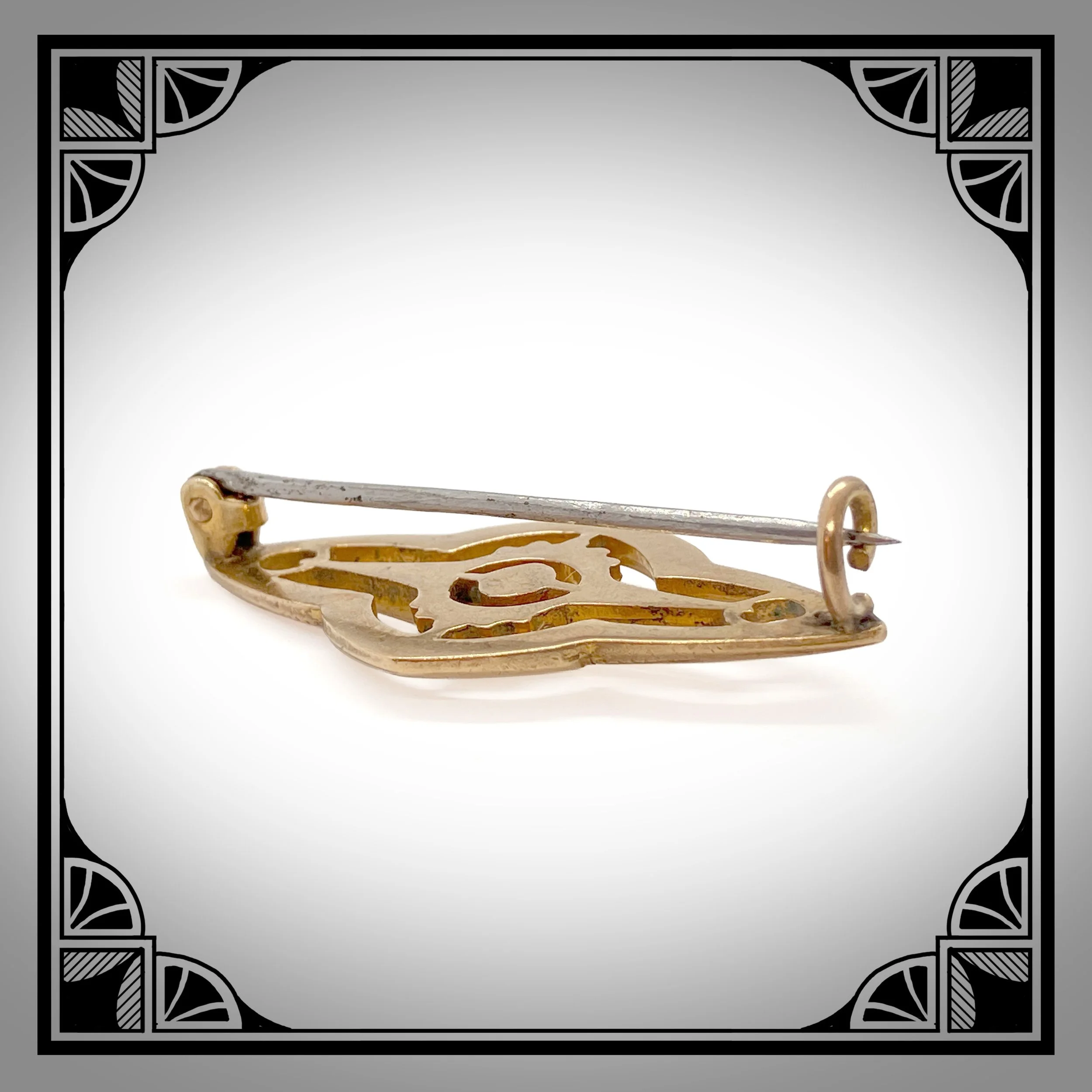 1910s Gold-Plated Openwork Brooch with die-struck rocailles, set with red gemstone 3.jpg