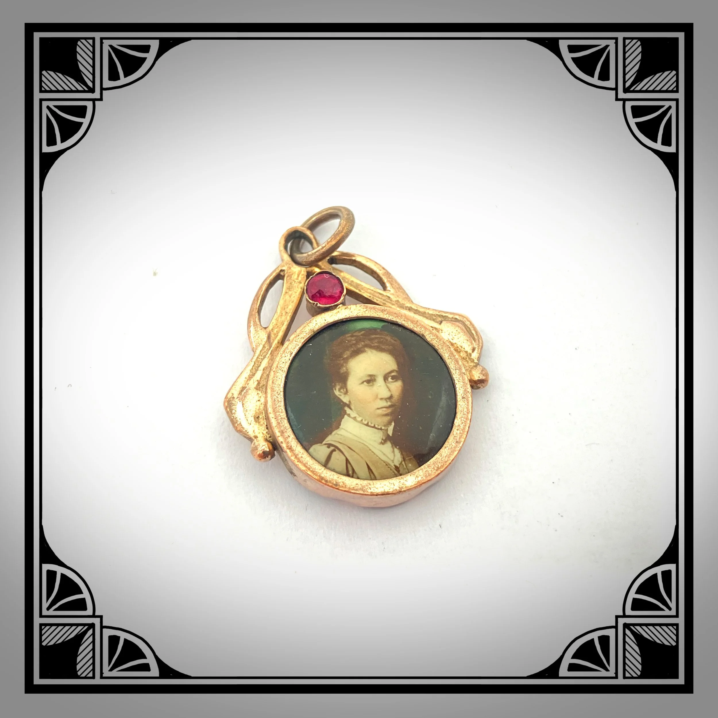 1900s Gold-Plated Art-Nouveau Picture Pendant with Hand-Tinted Portrait, set with Red Gemstone