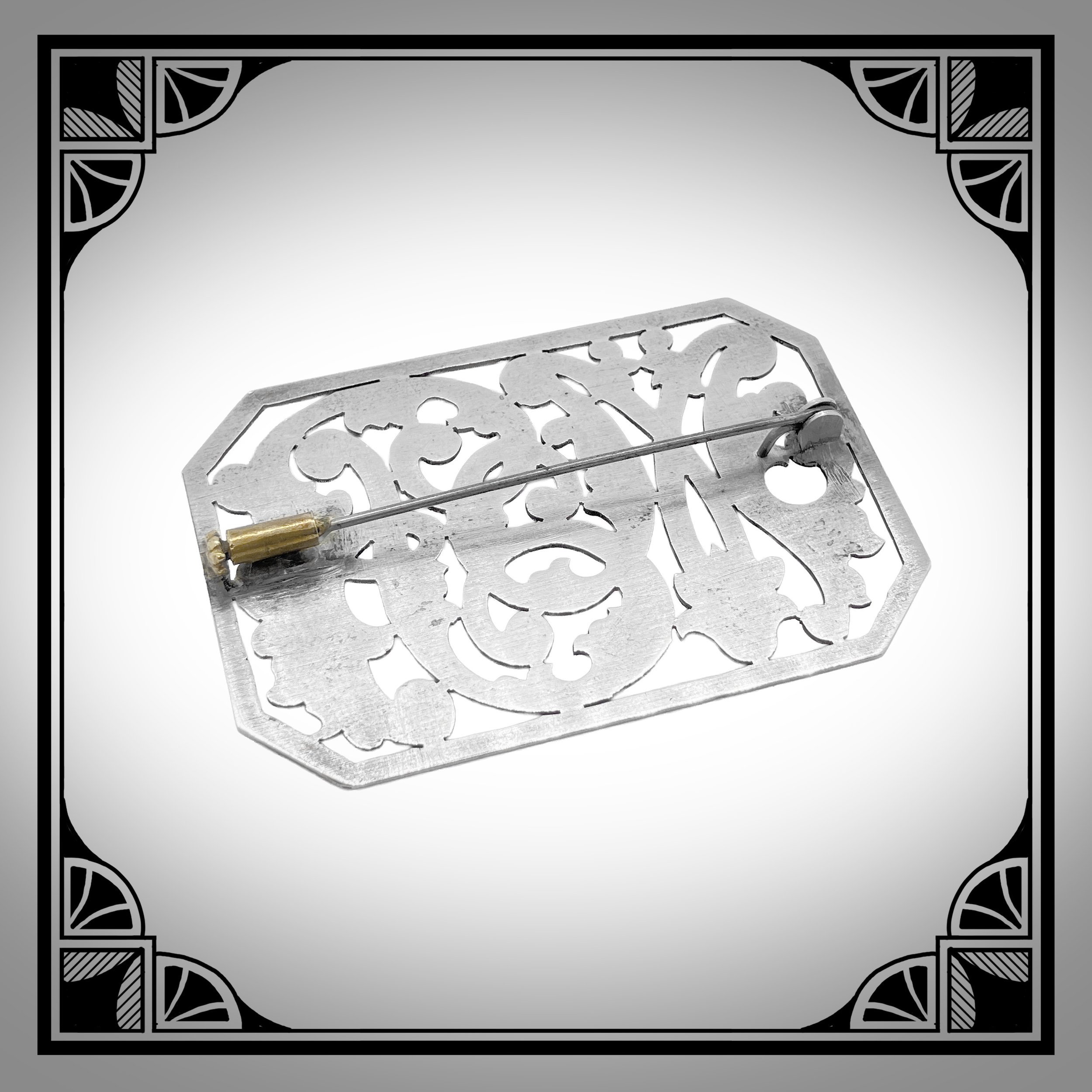 1920s Engraved Openwork Art-Deco initial brooch in White Metal 2.jpg