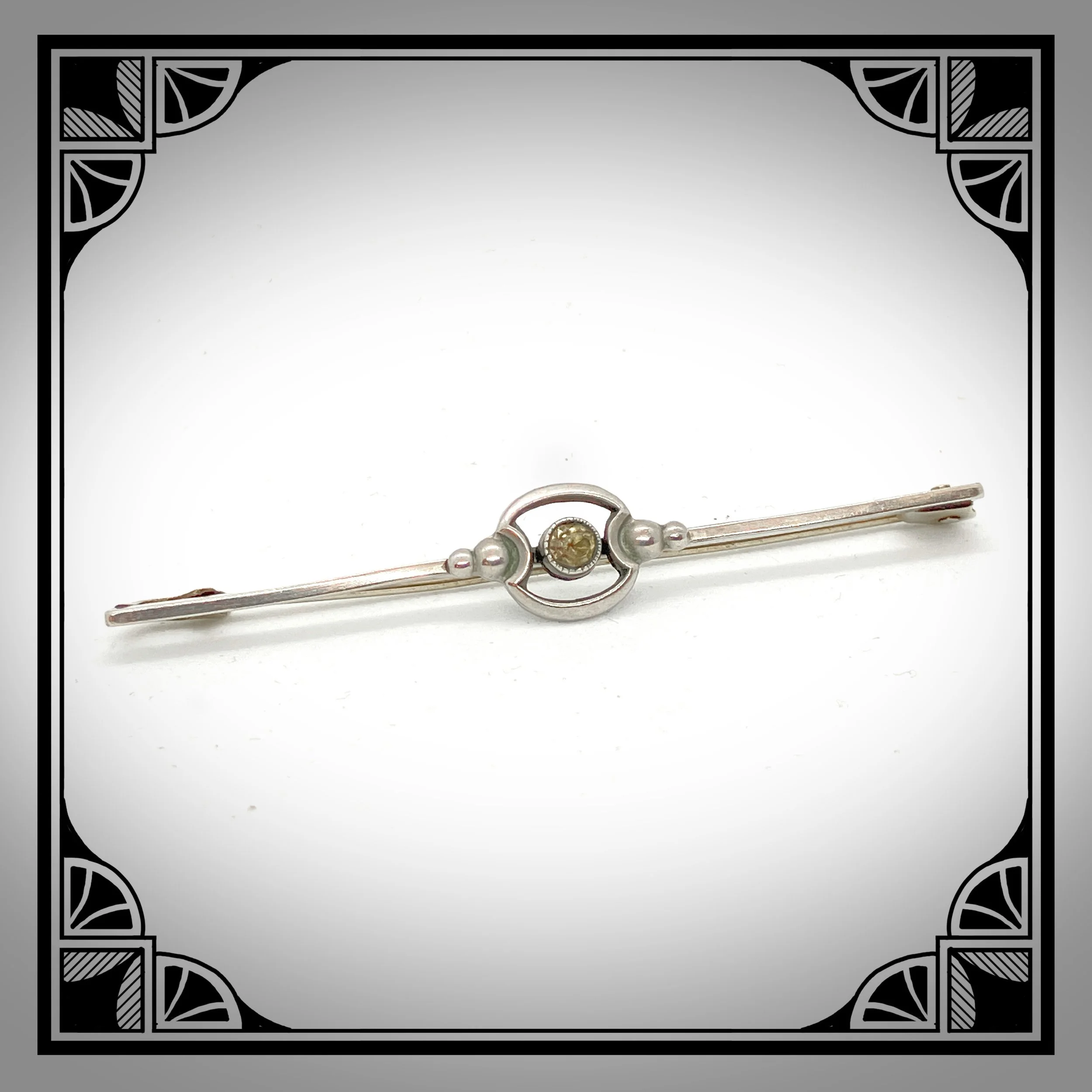 1920s Art Deco Bar brooch with yellow gemstone