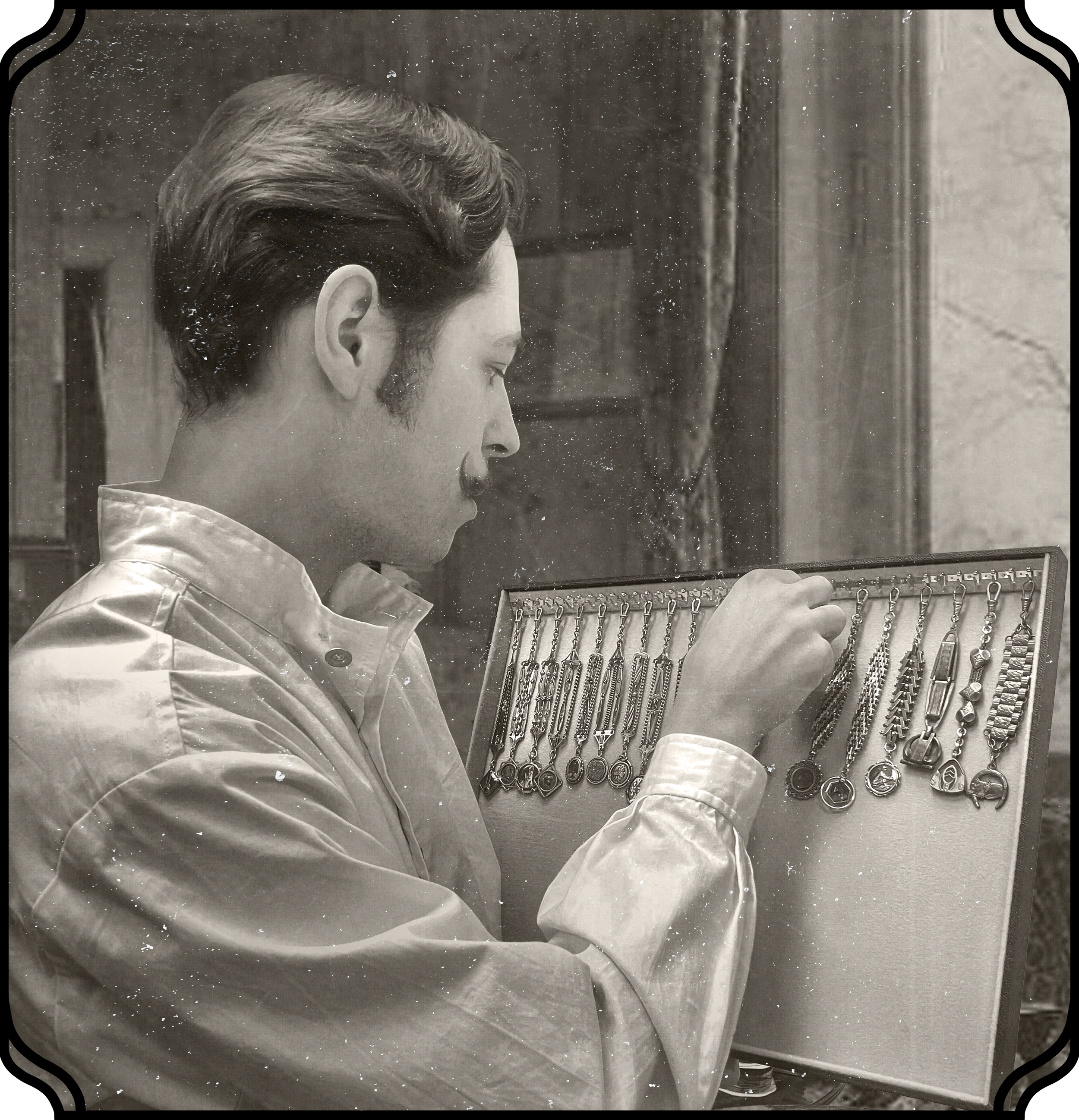 A man wearing a white shirt, closely examining a display of jewelry or watches in a case.