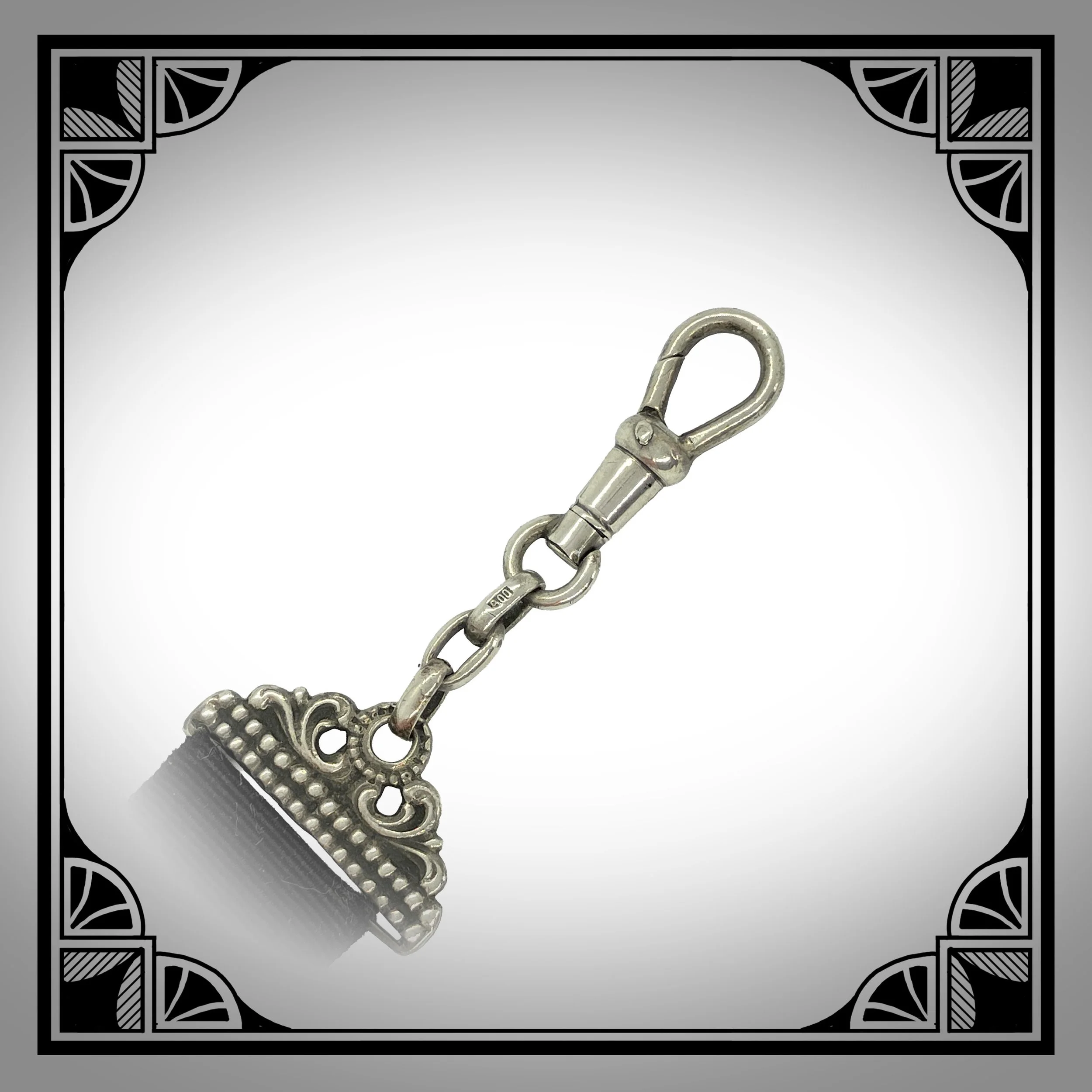 1920s Silver Openwork Ribbon Watch Fob 2.jpg